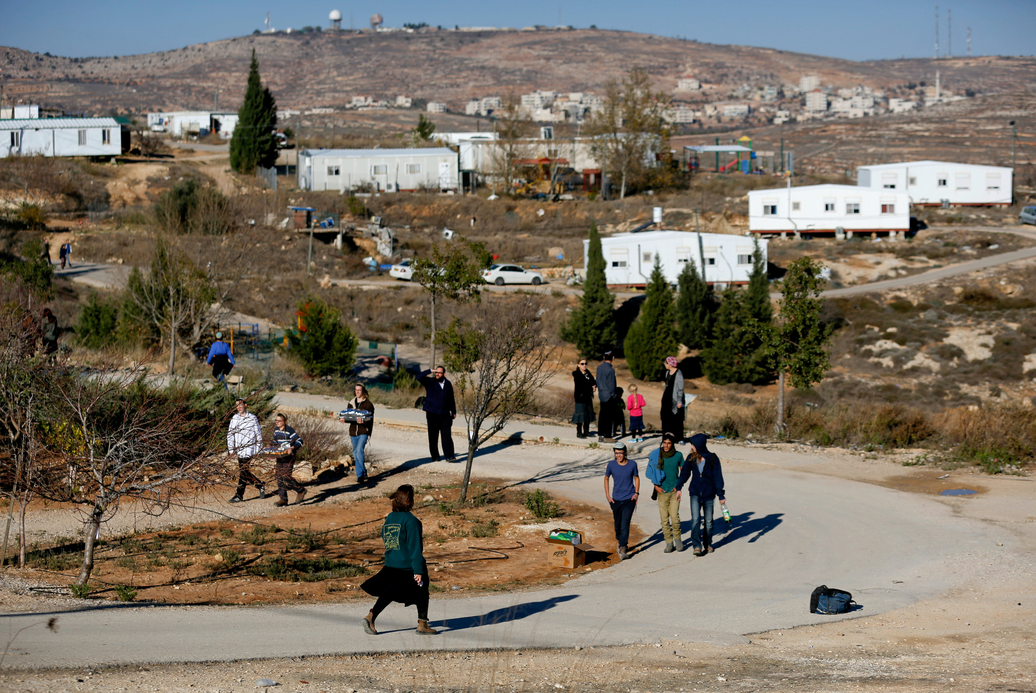 FILE PHOTO: Israelis prepare for an expected eviction of the Jewish settlement outpost of Amona in the West Bank, December 9, 2016 REUTERS/Amir Cohen/File Photo