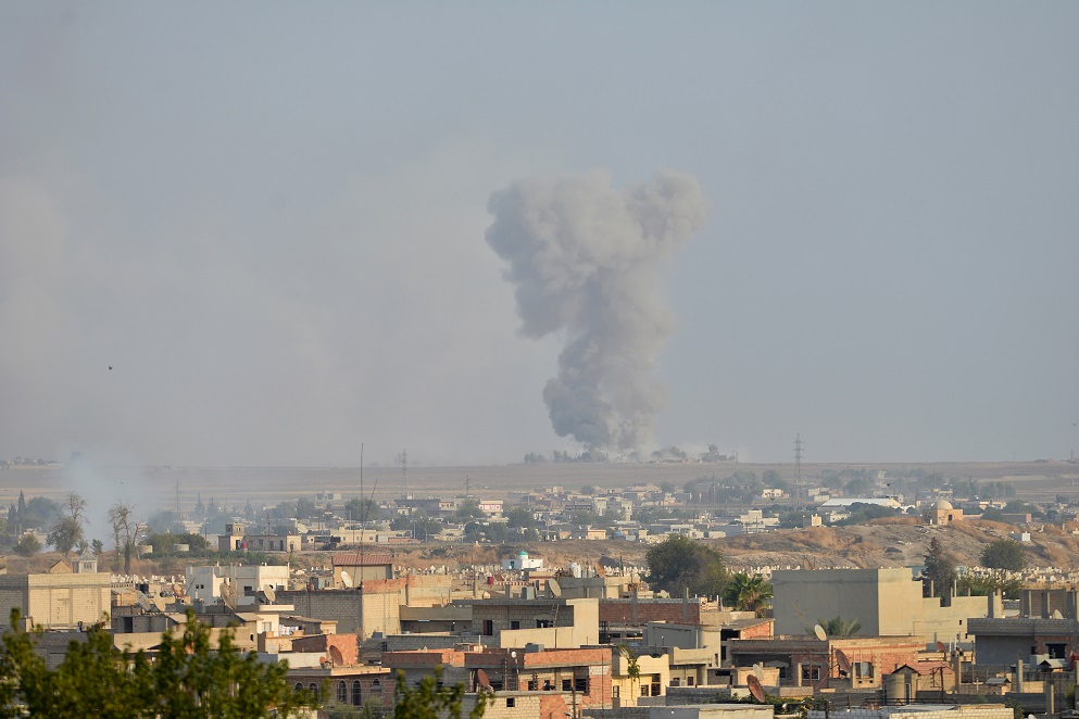 Smoke rises from the Syrian border town of Ras al-Ain as it is pictured from the Turkish town of Ceylanpinar in Sanliurfa province, Turkey, October 9, 2019. REUTERS/Stringer NO RESALES. NO ARCHIVES TUROUT