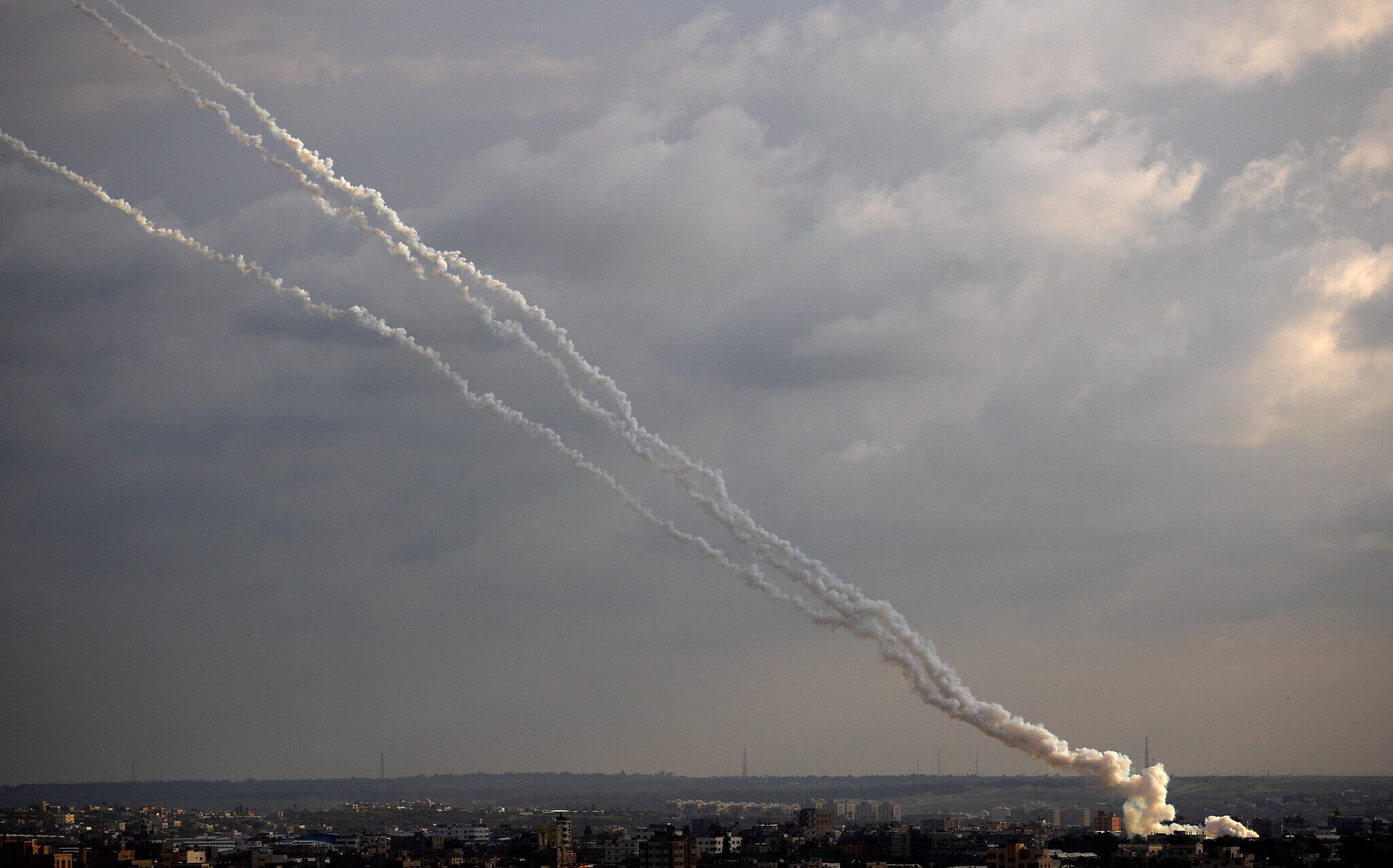 Rockets are launched from the Gaza Strip towards Israel, Monday, Feb. 24, 2020. (AP Photo/Khalil Hamra)