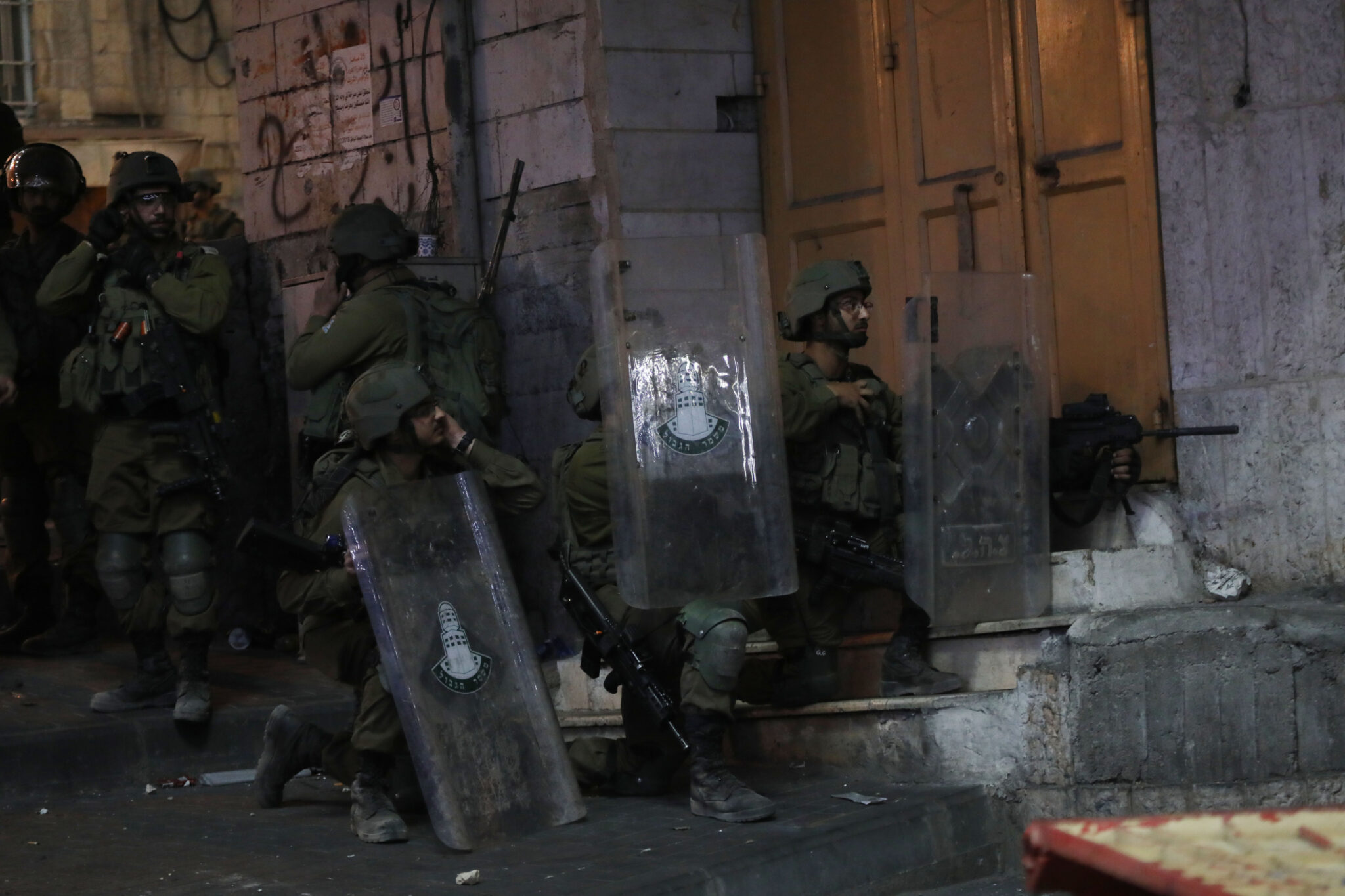 (210516) -- HEBRON, May 16, 2021 (Xinhua) -- Israeli soldiers are seen during an anti-Israel protest in the West Bank city of Hebron, May 15, 2021. Tension between Israelis and Palestinians has been flaring up over the past few days amid the escalating violence in East Jerusalem between Palestinian demonstrators and Israeli forces. (Photo by Mamoun Wazwaz/Xinhua)