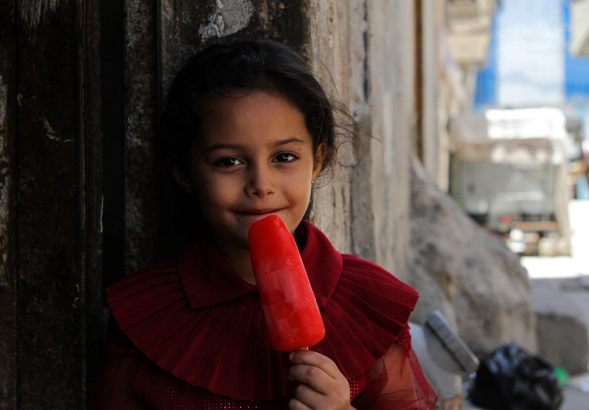 (210620) -- GAZA, June 20, 2021 (Xinhua) -- A Palestinian refugee child has a popsicle in Jabalia refugee camp in the northern Gaza Strip, on June 20, 2021, World Refugee Day. (Photo by Rizek Abdeljawad/Xinhua)