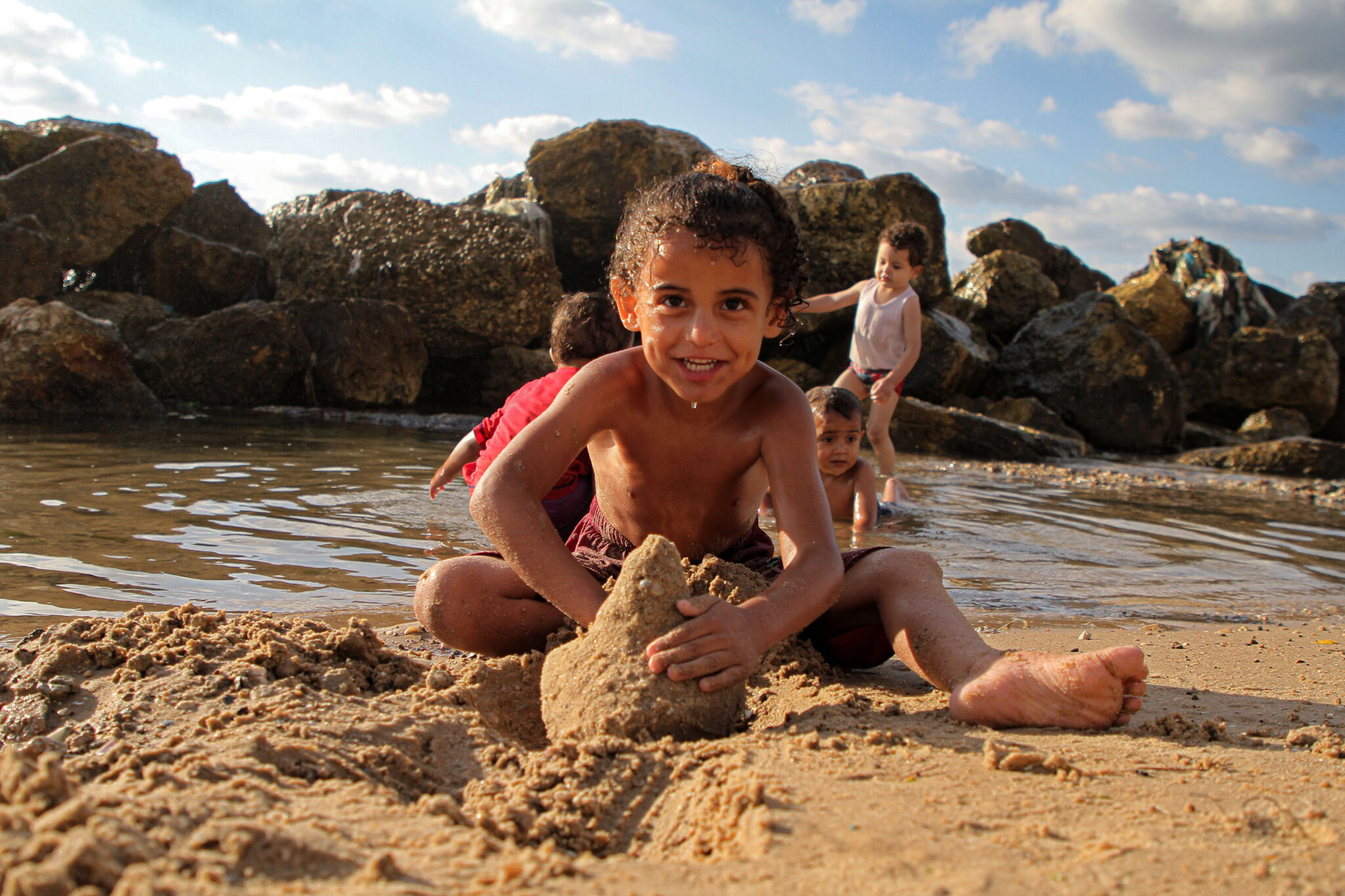 (210604) -- GAZA, June 4, 2021 (Xinhua) -- Palestinian children enjoy themselves in the Mediterranean Sea off Gaza coast in Gaza City, on June 4, 2021. (Photo by Rizek Abdeljawad/Xinhua)