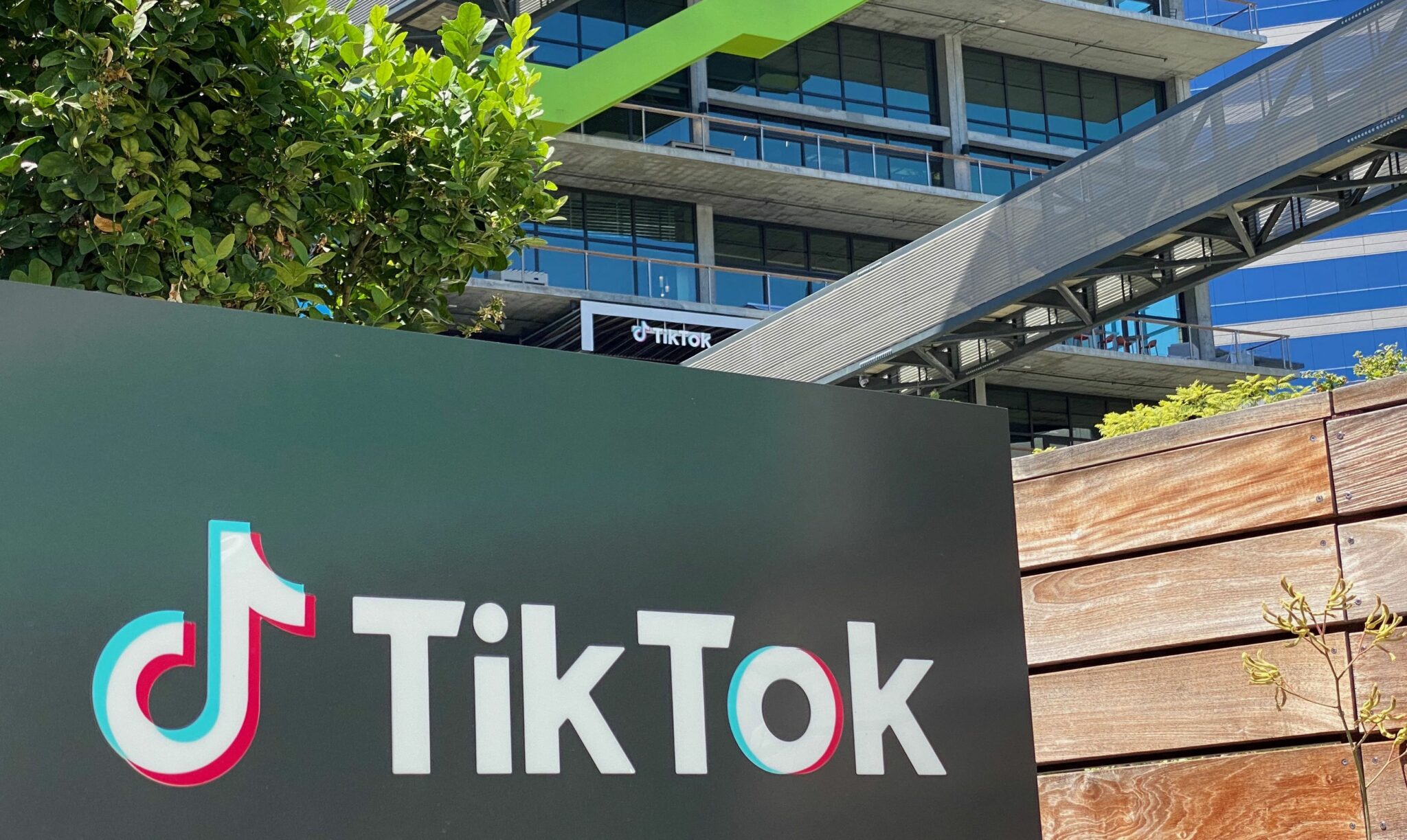 (FILES) In this file photo taken on August 11, 2020 the logo of Chinese video app TikTok is seen on the side of the company's office space at the C3 campus in Culver City, in the westside of Los Angeles. TikTok removed more than seven million accounts of users suspected of being under age 13 in the first three months of 2021, the popular social media operator said June 30, 2021 in a transparency report. The Chinese-owned app which is wildly popular with young smartphone users, also said it took down nearly 62 million videos in the first quarter for violating community standards -- including for "hateful" content, nudity, harassment or safety for minors. / AFP / Chris DELMAS