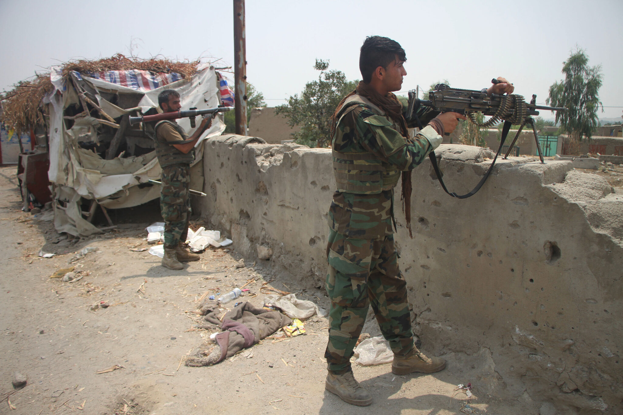 (210713) -- LAGHMAN, July 13, 2021 (Xinhua) -- Afghan security force members take part in a military operation against Taliban militants in Alishing district of Laghman province, eastern Afghanistan, on July 12, 2021. Taliban militants have been intensifying activities to capture more districts, as the U.S. troops are completing the pull-out from Afghanistan. In the meantime, Afghan security forces have been conducting counter-offensives to foil the militant group's efforts. (Photo by Saifurahman Safi/Xinhua)