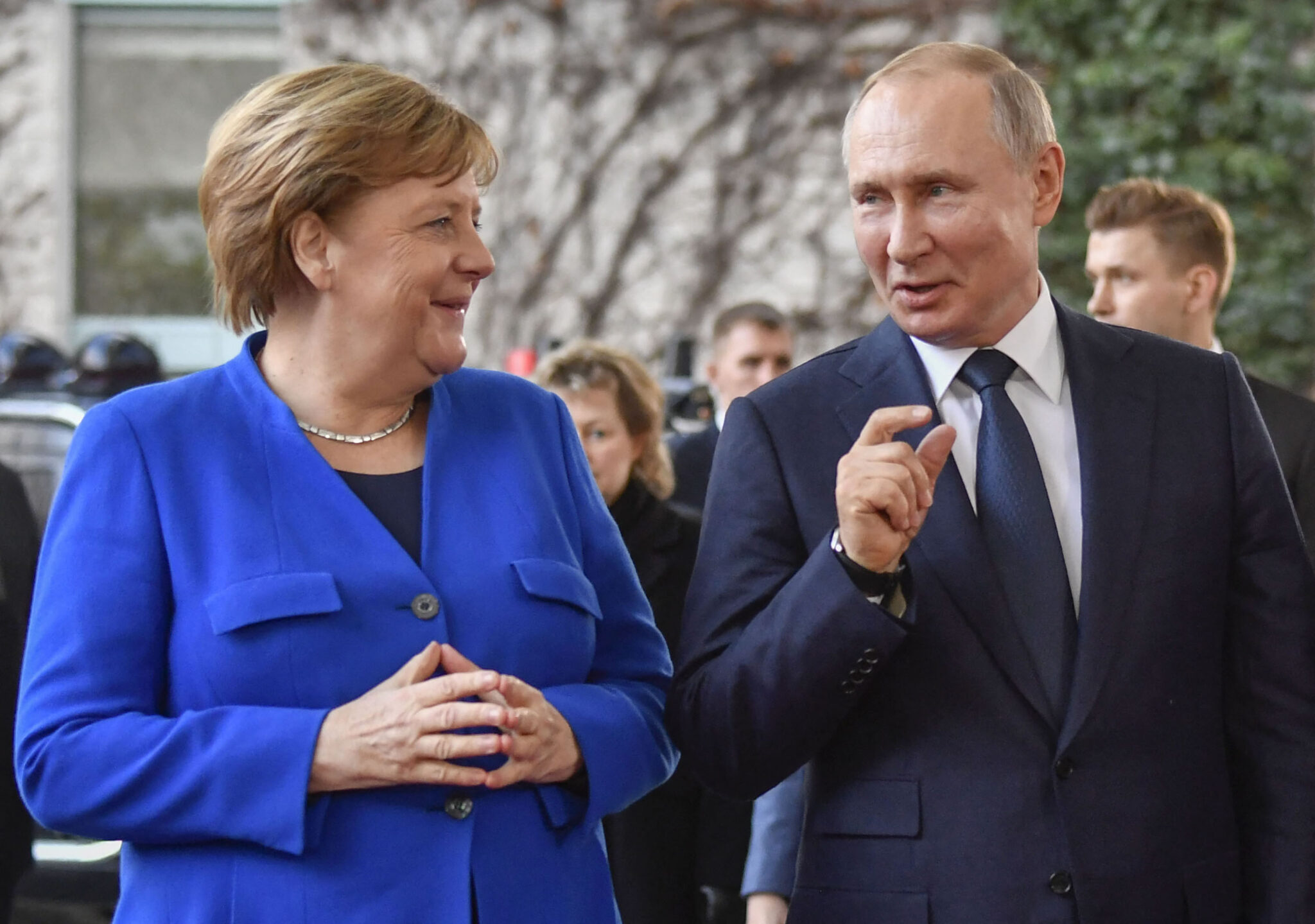 (FILES) In this file photo taken on January 19, 2020 German Chancellor Angela Merkel greets Russian President Vladimir Putin (C) with Secretary-General of the United Nations (UN) Antonio Guterres upon his arrival to attend the Peace summit on Libya at the Chancellery in Berlin. On August 20, 2021 German Chancellor Angela Merkel will be received in Moscow, in the midst of the Afghanistan crisis, by Vladimir Putin, before leaving office in autumn. - ALTERNATIVE CROP (Photo by John MACDOUGALL / AFP) / ALTERNATIVE CROP