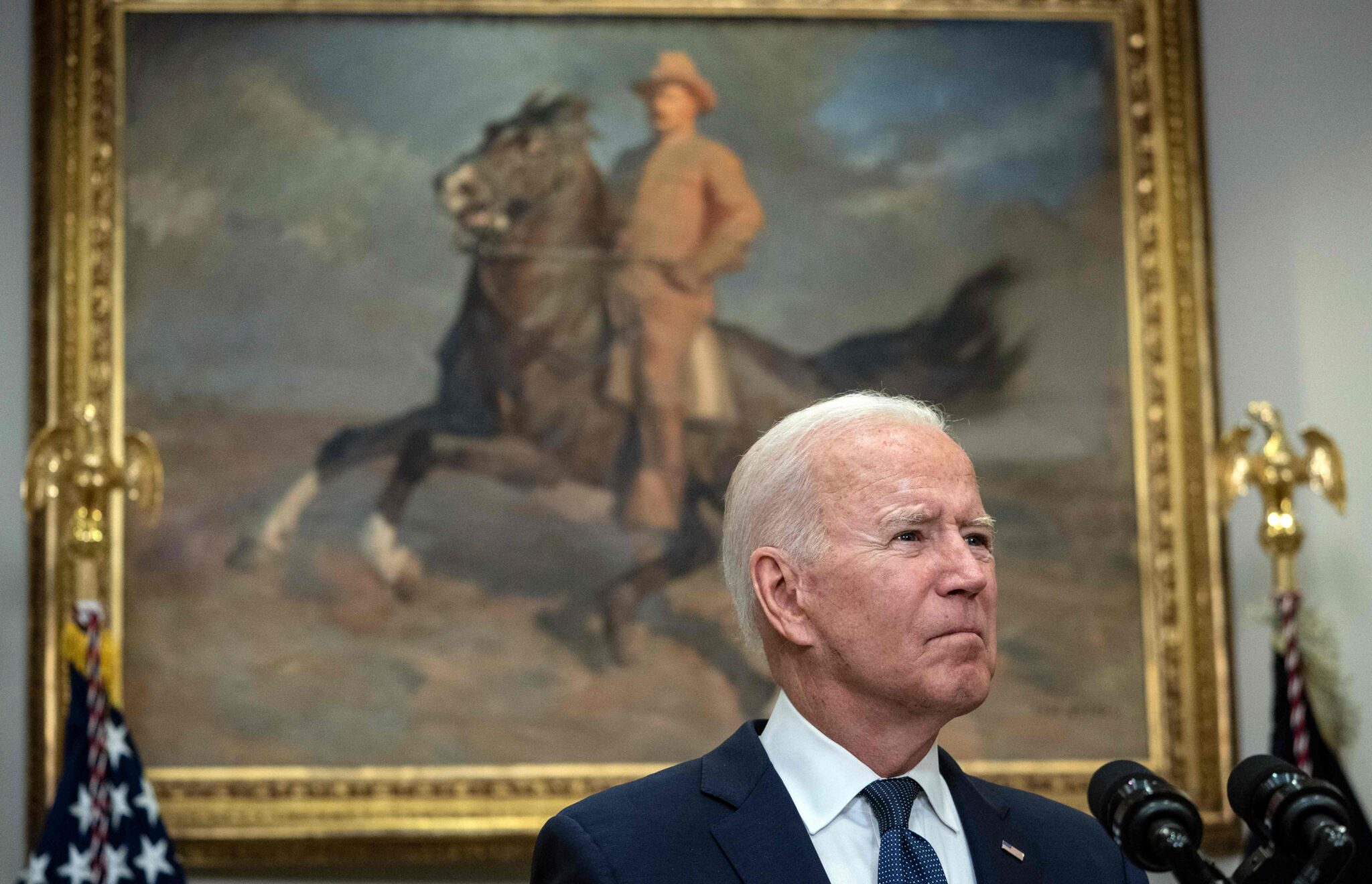 US President Joe Biden speaks during an update on the situation in Afghanistan and the effects of Tropical Storm Henri in the Roosevelt Room of the White House in Washington, DC on August 22, 2021. US President Joe Biden said Sunday he was still planning to finalize the dramatic evacuation from Afghanistan by August 31, but left the door open to extending the deadline if necessary. (Photo by ANDREW CABALLERO-REYNOLDS / AFP)