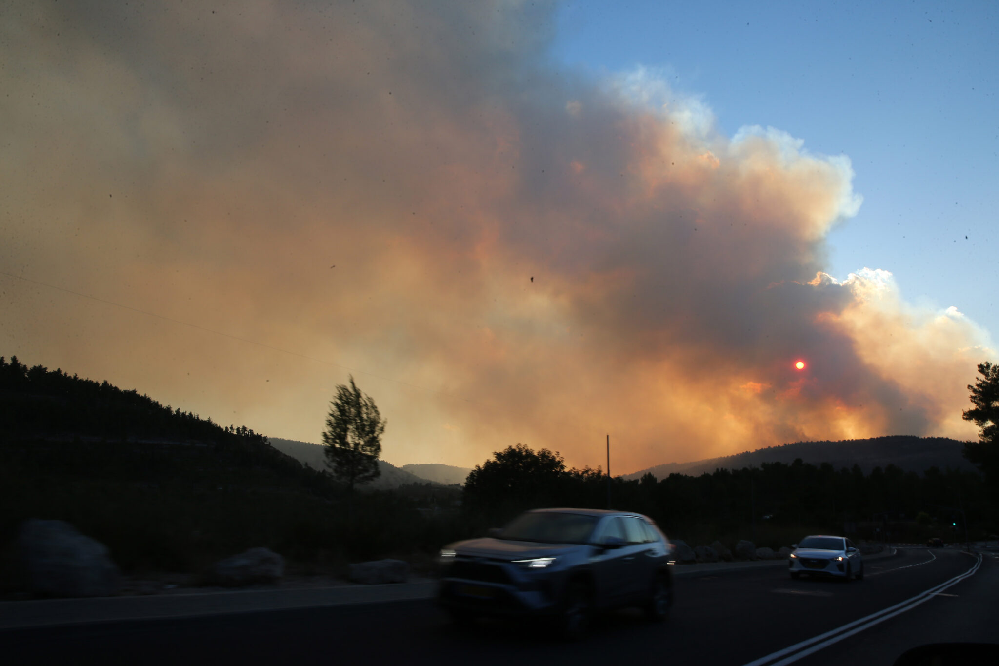 (210815) -- JERUSALEM, Aug. 15, 2021 (Xinhua) -- Smoke caused by wildfire is seen near Jerusalem on Aug. 15, 2021. Huge wildfire near Jerusalem sent thick black clouds over the city on Sunday as hundreds of firefighters were struggling to subdue the fire, Israeli authorities said. At least 10,000 people have been evacuated from their homes in the Jerusalem area, a spokesperson with the Jerusalem police said in a statement. (Photo by Muammar Awad/Xinhua)