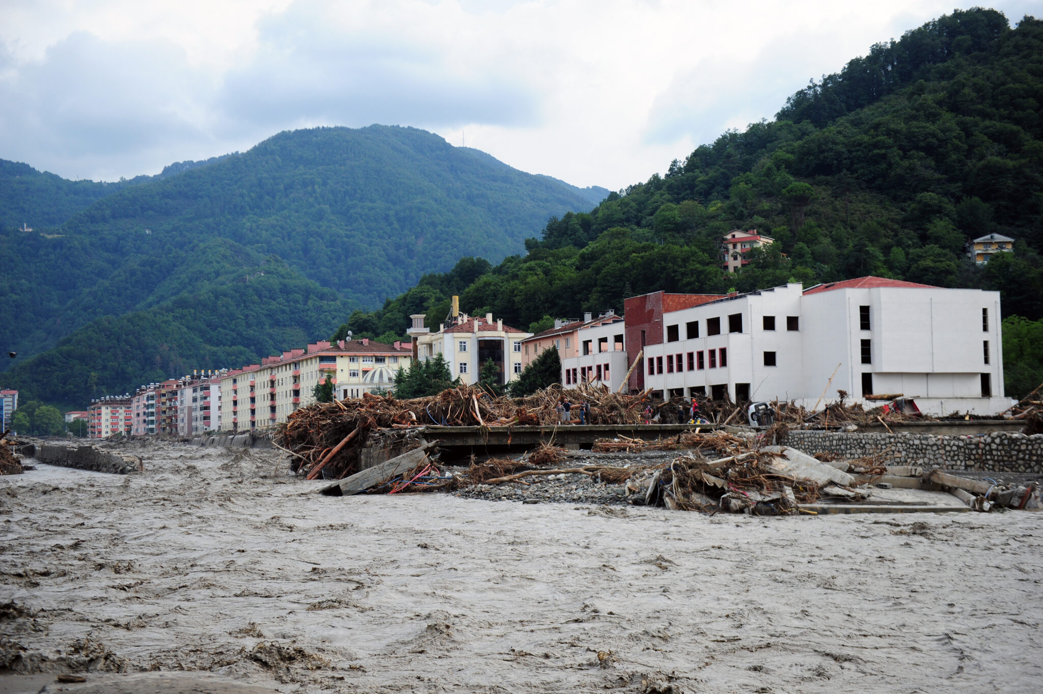 (210812) -- KASTAMONU (TURKEY), Aug. 12, 2021 (Xinhua) -- Photo taken on Aug. 12, 2021 shows a residential area affected by floods in Bozkurt district of Kastamonu province, Turkey. Turkish President Recep Tayyip Erdogan on Thursday announced that 17 people were killed in the country's flood-struck Black Sea region. The heavy rainfall starting on Wednesday in Bartin, Kastamonu, and Sinop provinces triggered flash floods and landslides, demolishing some homes and bridges, and sweeping away some cars. (Xinhua)