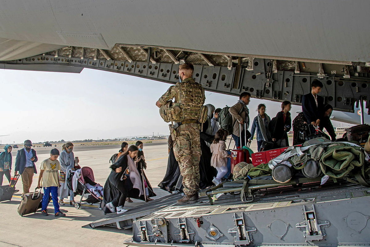 British citizens and dual nationals residing in Afghanistan board a military plane for evacuation from Kabul airport, Afghanistan August 16, 2021, in this handout picture obtained by Reuters on August 17, 2021. LPhot Ben Shread/UK MOD Crown copyright 2021/Handout via REUTERS