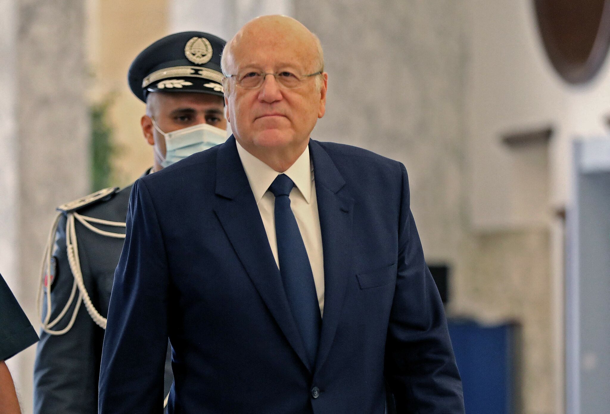 Lebanese Prime Minister-designate Najib Mikati arrives for the first cabinet meeting at the presidential palace in Baabda, east of the capital Beirut, on September 13, 2021. Lebanese commentators voiced scepticism over the bankrupt state's ability to win back the support of foreign donors after political factions finally agreed a new government following 13 months of horse-trading. (Photo by Anwar AMRO / AFP)