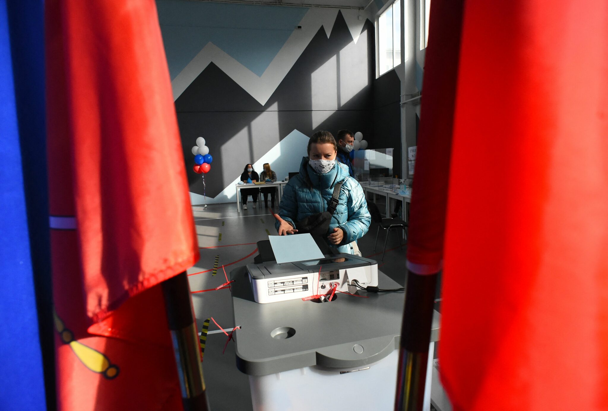 People vote during the last day of the three-day parliamentary and local elections in Saint Petersburg on September 19, 2021. (Photo by Olga MALTSEVA / AFP)