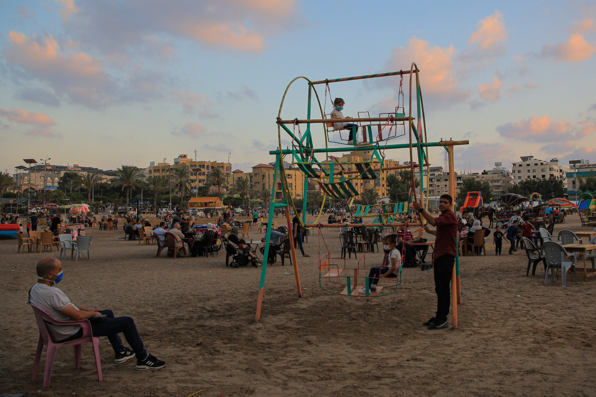 (210903) -- GAZA, Sept. 3, 2021 (Xinhua) -- Palestinian people enjoy their time at a park in Gaza City, on Sept. 3, 2021. (Photo by Rizek Abdeljawad/Xinhua)