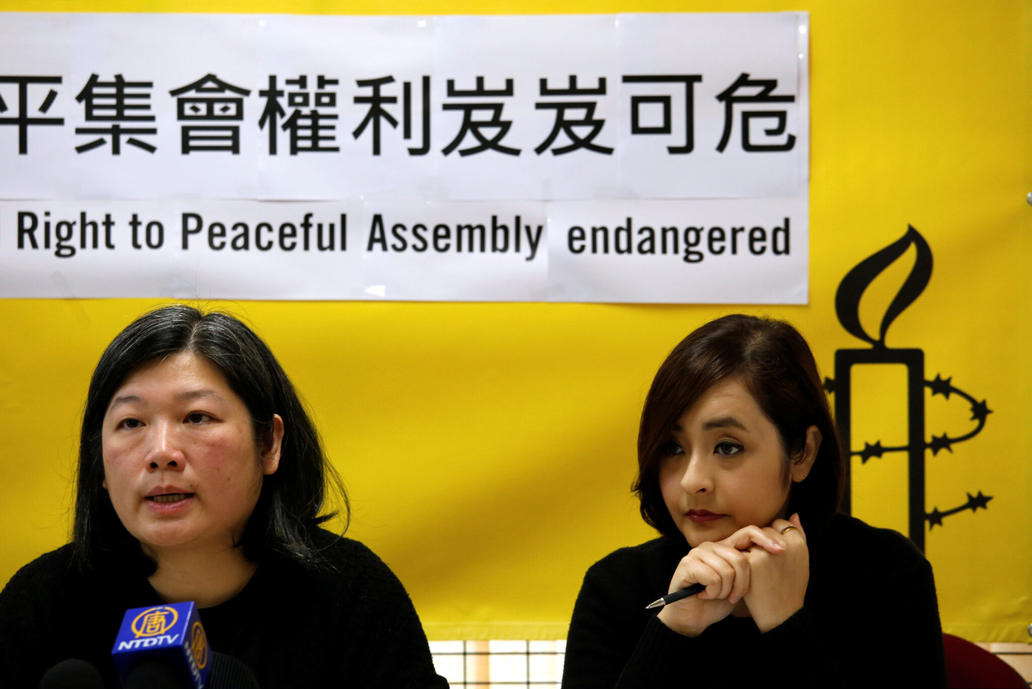 Amnesty International Hong Kong Director Mabel Au (L) and Chairperson Raees Baig attend a news conference in Hong Kong, China February 22, 2018. REUTERS/Bobby Yip