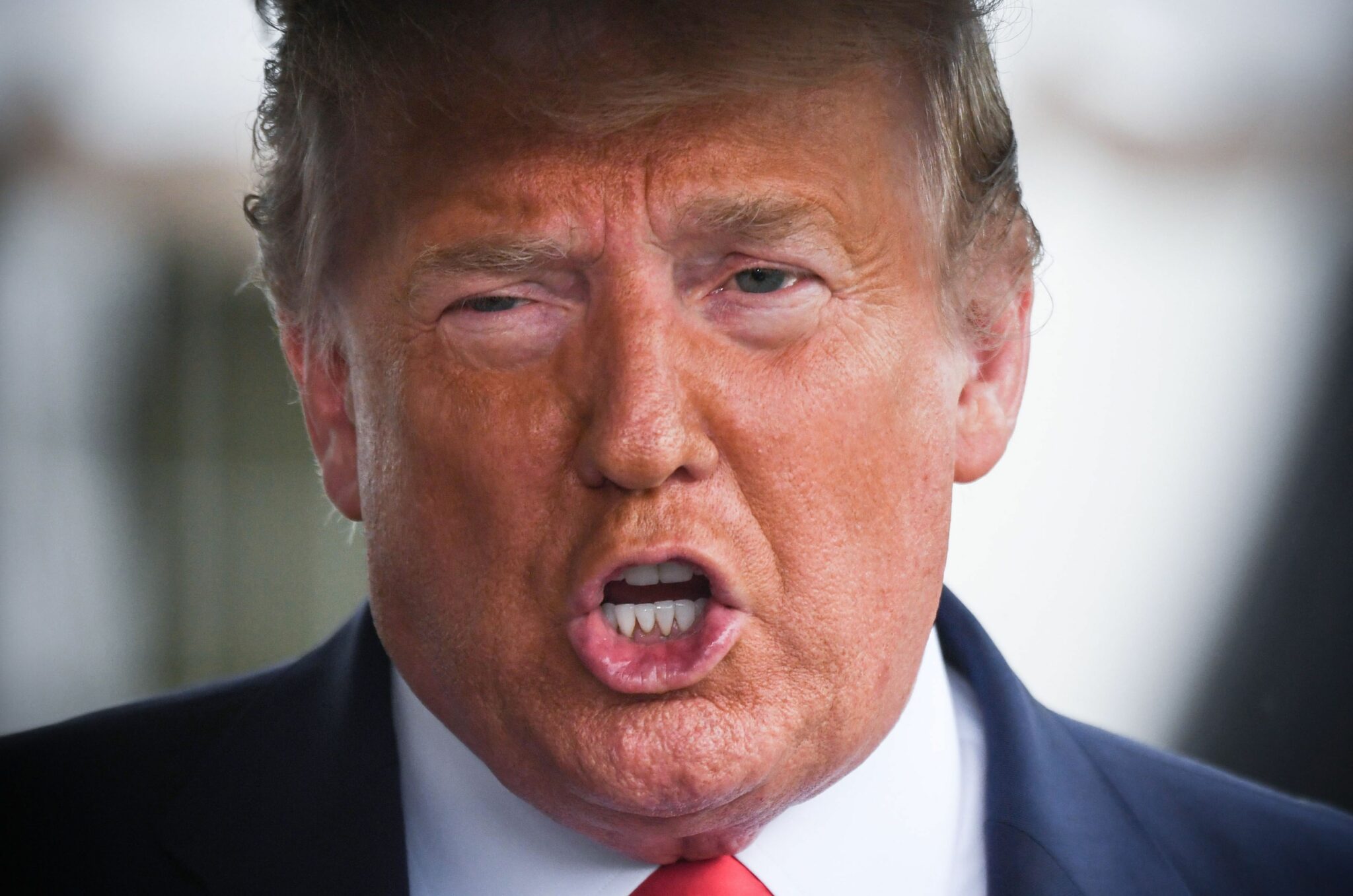 (FILES) In this file photo taken on June 20, 2020 US President Donald Trump speaks to the press before departing the White House in Washington, DC, for a campaign rally in Tulsa, Oklahoma. Former president Donald Trump has told four former senior aides not to comply with a congressional probe into the January 6 attack on Congress, US media reported on October 7, 2021. (Photo by Eric BARADAT / AFP)