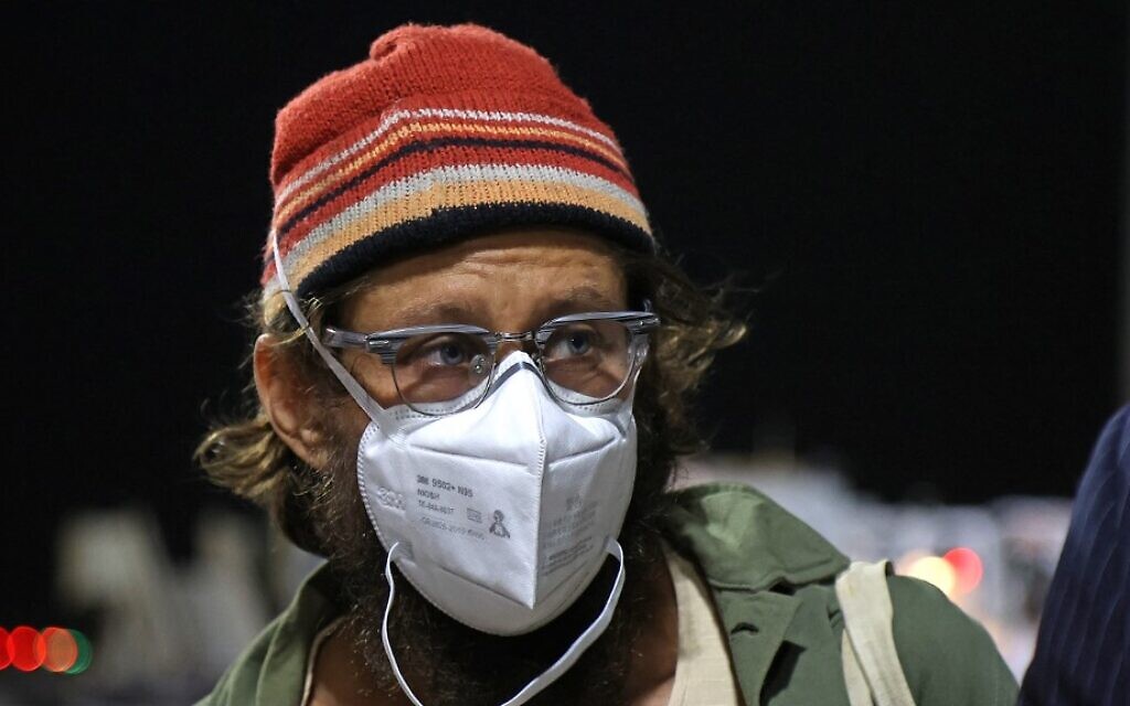 US journalist Danny Fenster, who was imprisoned in Myanmar, speaks to the press upon his arrival at Hamad International Airport in Qatar's capital Doha on November 15, 2021. - A US journalist imprisoned in Myanmar since May was pardoned and deported, a day before he was due to face terror and sedition charges that could have jailed him for life. The military has squeezed the press since taking power in a February coup, arresting dozens of journalists critical of its crackdown on dissent, which has killed more than 1,200 people according to a local monitoring group. (Photo by KARIM JAAFAR / AFP)