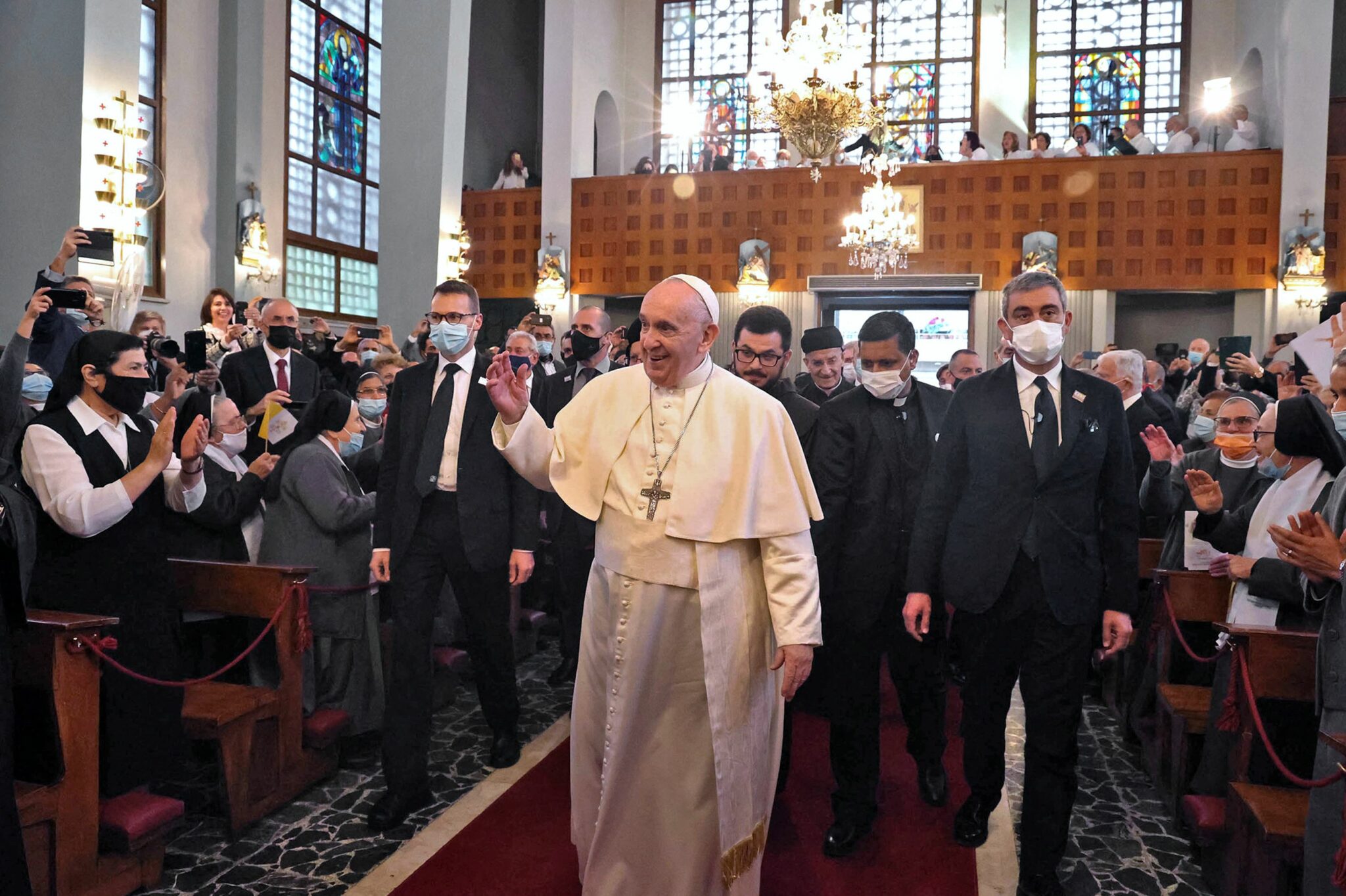 A handout picture provided by the Cypriot government's Press and Information Office (PIO) shows Pope Francis arriving for a meeting at the Maronite Lady of Grace cathedral, in the capital Nicosia, on December 2, 2021. The pontiff, 84, is on a landmark trip to the predominantly Greek Orthodox east Mediterranean island to push two of his priorities: the plight of migrants and inter-confessional dialogue - === RESTRICTED TO EDITORIAL USE - MANDATORY CREDIT "AFP PHOTO / HO / PIO" - NO MARKETING NO ADVERTISING CAMPAIGNS - DISTRIBUTED AS A SERVICE TO CLIENTS === (Photo by PIO / AFP) / === RESTRICTED TO EDITORIAL USE - MANDATORY CREDIT "AFP PHOTO / HO / PIO" - NO MARKETING NO ADVERTISING CAMPAIGNS - DISTRIBUTED AS A SERVICE TO CLIENTS ===