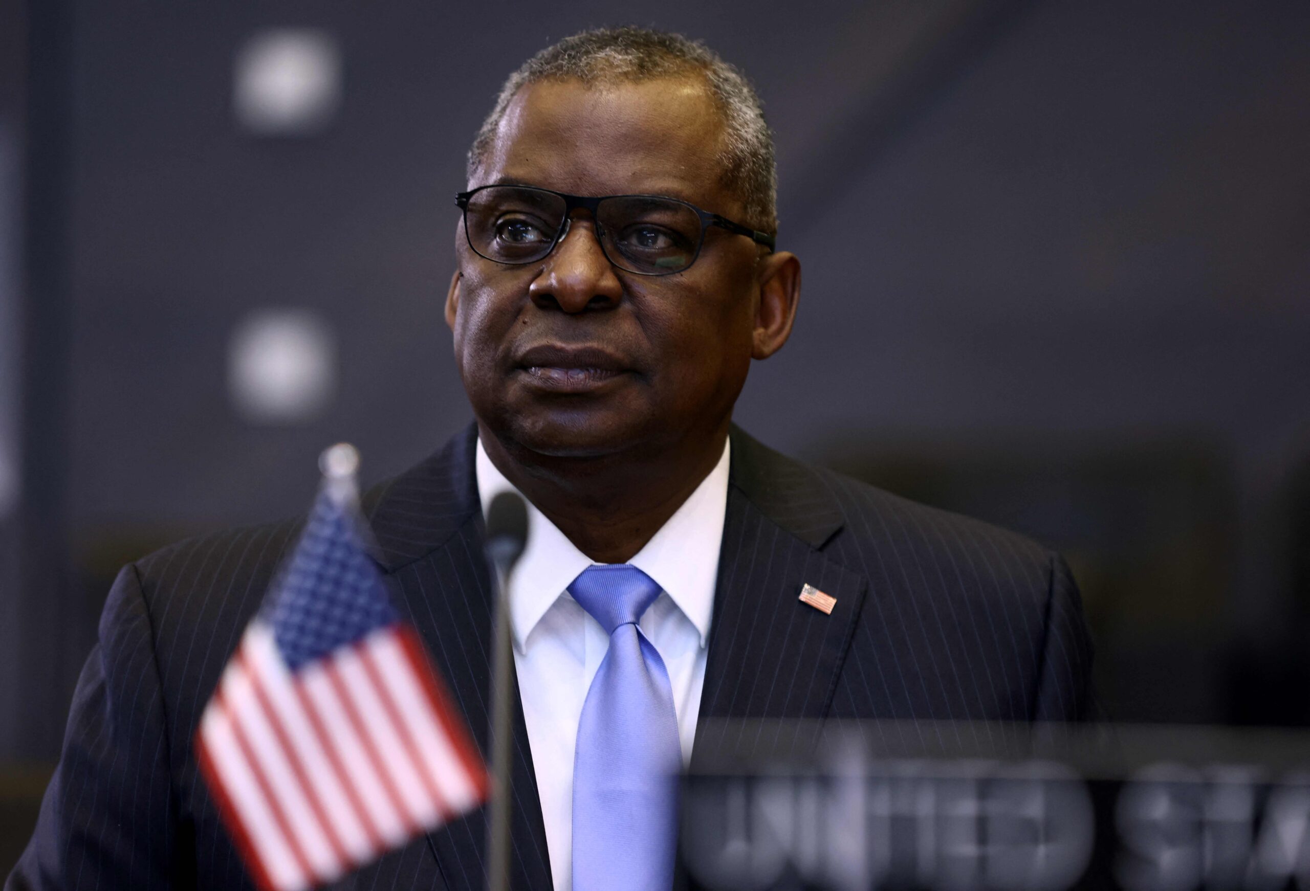 (FILES) In this file photo taken on October 21, 2021 US Defense Secretary Lloyd Austin looks on at the start of the round table during the Meeting of NATO Ministers of Defence in Brussels. US Secretary of Defense Lloyd Austin said in a statement released on January 2, 2022 that he has tested positive for Covid-19 and was exhibiting "mild symptoms". (Photo by Kenzo Tribouillard / AFP)