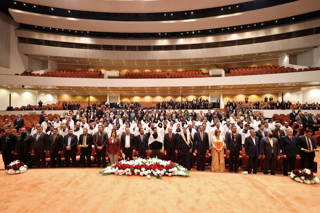 A handout picture released by Iraq's Prime Minister's Media Office on January 9, 2022 shows Iraqi lawmakers attending the inaugural session of the parliament in Baghdad, three months after legislative elections. Iraq's new parliament held its inaugural session Sunday, three months after legislative elections won by Shiite Muslim firebrand cleric Moqtada Sadr, the likely kingmaker of the next government. - === RESTRICTED TO EDITORIAL USE - MANDATORY CREDIT "AFP PHOTO / HO / IRAQI PRIME MINISTER'S PRESS OFFICE" - NO MARKETING NO ADVERTISING CAMPAIGNS - DISTRIBUTED AS A SERVICE TO CLIENTS === (Photo by IRAQI PRIME MINISTER'S PRESS OFFICE / AFP) / === RESTRICTED TO EDITORIAL USE - MANDATORY CREDIT "AFP PHOTO / HO / IRAQI PRIME MINISTER'S PRESS OFFICE" - NO MARKETING NO ADVERTISING CAMPAIGNS - DISTRIBUTED AS A SERVICE TO CLIENTS ===