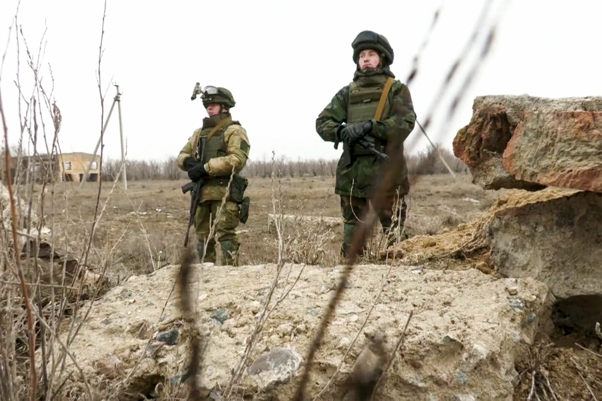 This handout picture taken and released by the Russian Defence Ministry on January 11, 2022 shows Collective Security Treaty Organization's (CSTO) Belarus soldiers standing guard at Zhetygen airport, 60km north of Alamaty. In Kazakhstan's largest city a Russia-led peacekeeping force sent to restore order after clashes that left dozens dead is making its presence felt, despite being all but invisible to citizens. - RESTRICTED TO EDITORIAL USE - MANDATORY CREDIT "AFP PHOTO / Russian Defence Ministry " - NO MARKETING - NO ADVERTISING CAMPAIGNS - DISTRIBUTED AS A SERVICE TO CLIENTS (Photo by Handout / RUSSIAN DEFENCE MINISTRY / AFP) / RESTRICTED TO EDITORIAL USE - MANDATORY CREDIT "AFP PHOTO / Russian Defence Ministry " - NO MARKETING - NO ADVERTISING CAMPAIGNS - DISTRIBUTED AS A SERVICE TO CLIENTS