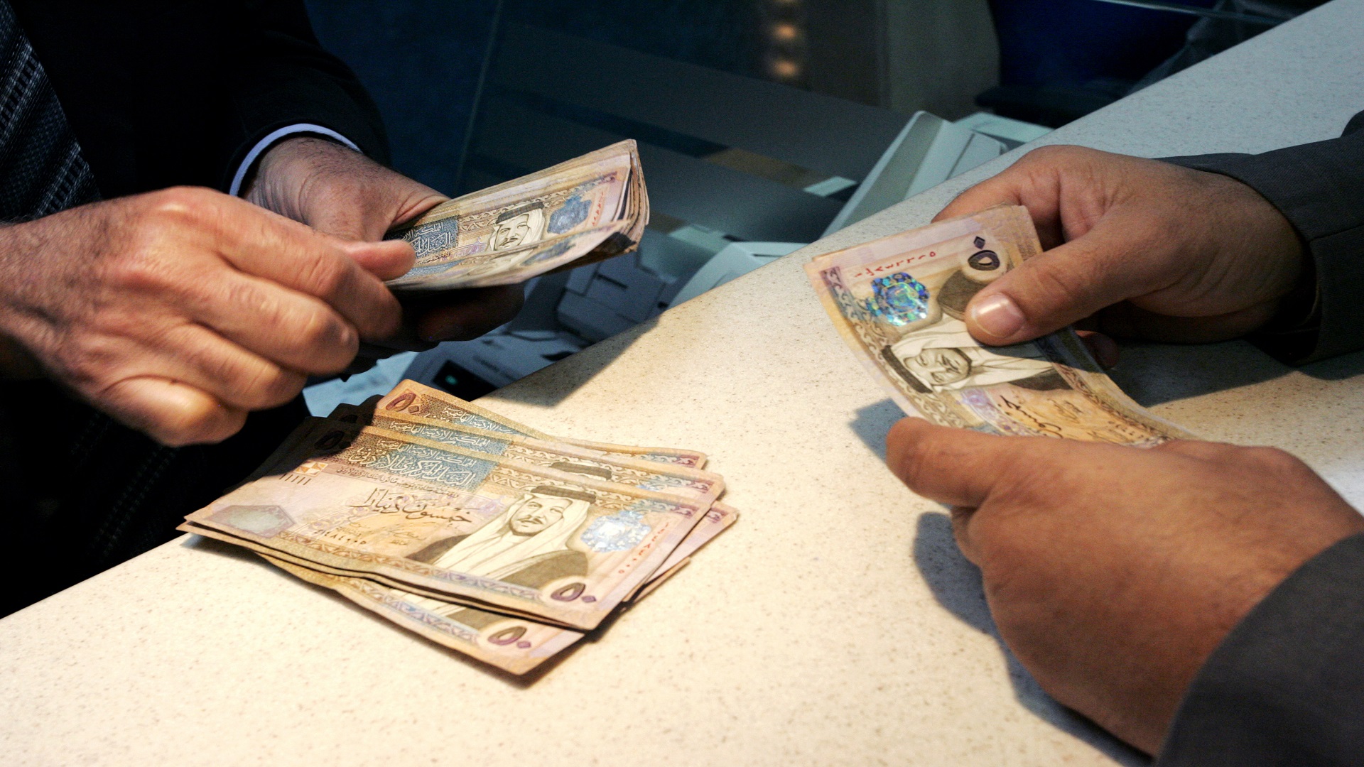 Counting Money in bank, Aman, Jordan