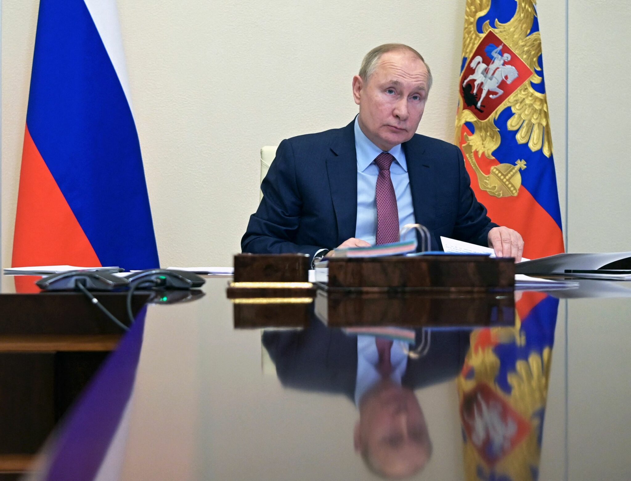 Russia's President Vladimir Putin chairs a meeting with Italian businessmen via a video conference at the Novo-Ogaryovo residence outside Moscow, on January 26, 2022. (Photo by Alexey NIKOLSKY / SPUTNIK / AFP)