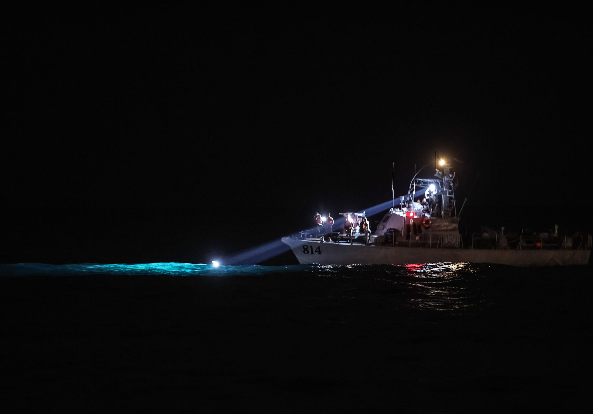 (220103) -- HAIFA, Jan. 3, 2022 (Xinhua) -- A ship of security forces searches for a crashed helicopter near the coast of Haifa, Israel, on Jan. 3, 2022. Three crew members were evacuated to hospital on Monday night after a helicopter crash off Israel's northern shore, the country's national Magen David Adom emergency health service said. (JINI via Xinhua)