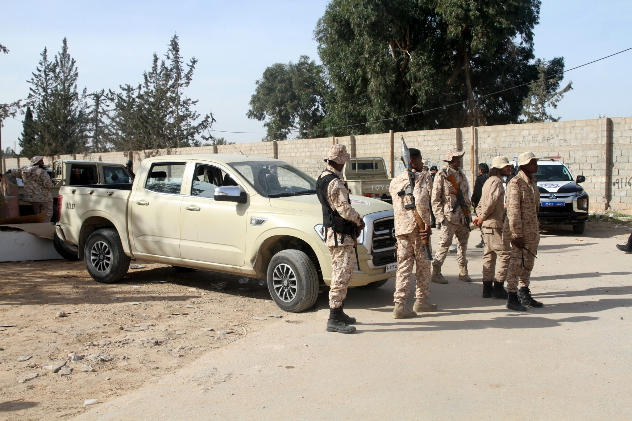 (211226) -- TRIPOLI, Dec. 26, 2021 (Xinhua) -- Military personnel are seen in Ain Zara area in southern Tripoli, Libya, Dec. 25, 2021. A number of roads in southern Tripoli were reopened Saturday after they were closed due to recent military mobilization. (Photo by Hamza Turkia/Xinhua)