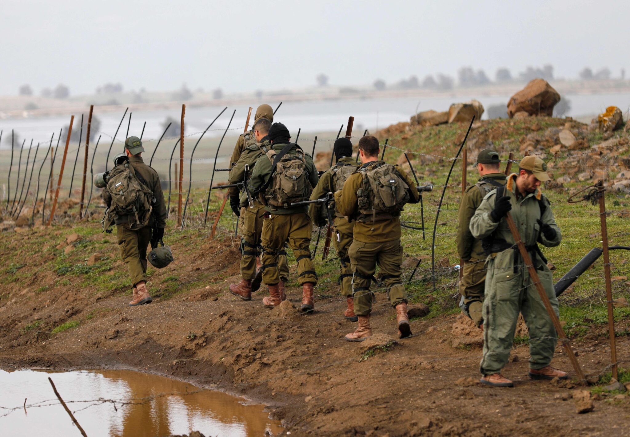 Israeli soldiers take part in a military drill near Kibbutz Merom Golan in the Israel-annexed Golan Heights on January 31, 2022. (Photo by JALAA MAREY / AFP)