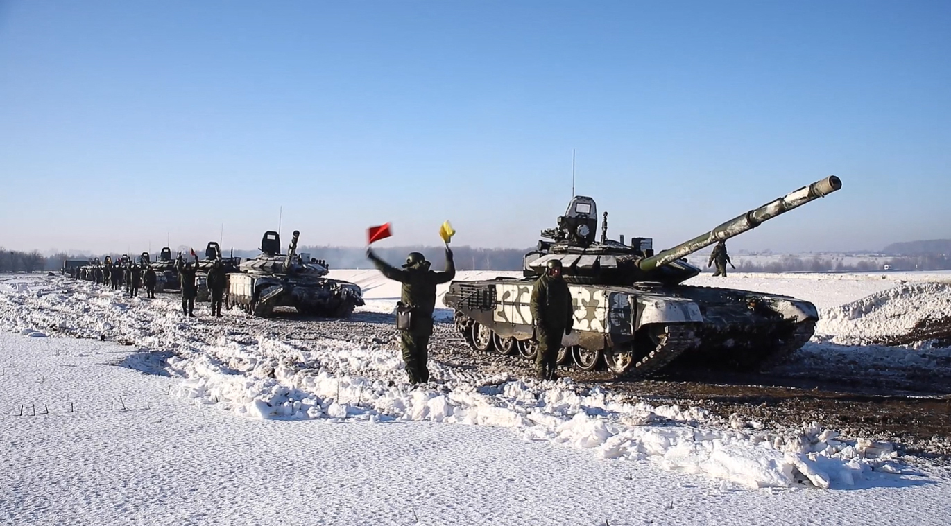 This handout video grab released by the Russian Defence Ministry on February 15, 2022, shows Russian tanks leaving for Russia after joint exercises of the armed forces of Russia and Belarus as part of an inspection of the Union State's Response Force, at a firing range near Brest. Russia said on February 15, 2022 it was pulling back some of its forces near the Ukrainian border to their bases, in what would be the first major step towards de-escalation in weeks of crisis with the West. The move came amid an intense diplomatic effort to avert a feared Russian invasion of its pro-Western neighbour and after Moscow amassed more than 100,000 troops near Ukraine's borders. - RESTRICTED TO EDITORIAL USE - MANDATORY CREDIT "AFP PHOTO / RUSSIAN DEFENCE MINISTRY" - NO MARKETING - NO ADVERTISING CAMPAIGNS - DISTRIBUTED AS A SERVICE TO CLIENTS (Photo by Handout / RUSSIAN DEFENCE MINISTRY / AFP) / RESTRICTED TO EDITORIAL USE - MANDATORY CREDIT "AFP PHOTO / RUSSIAN DEFENCE MINISTRY" - NO MARKETING - NO ADVERTISING CAMPAIGNS - DISTRIBUTED AS A SERVICE TO CLIENTS