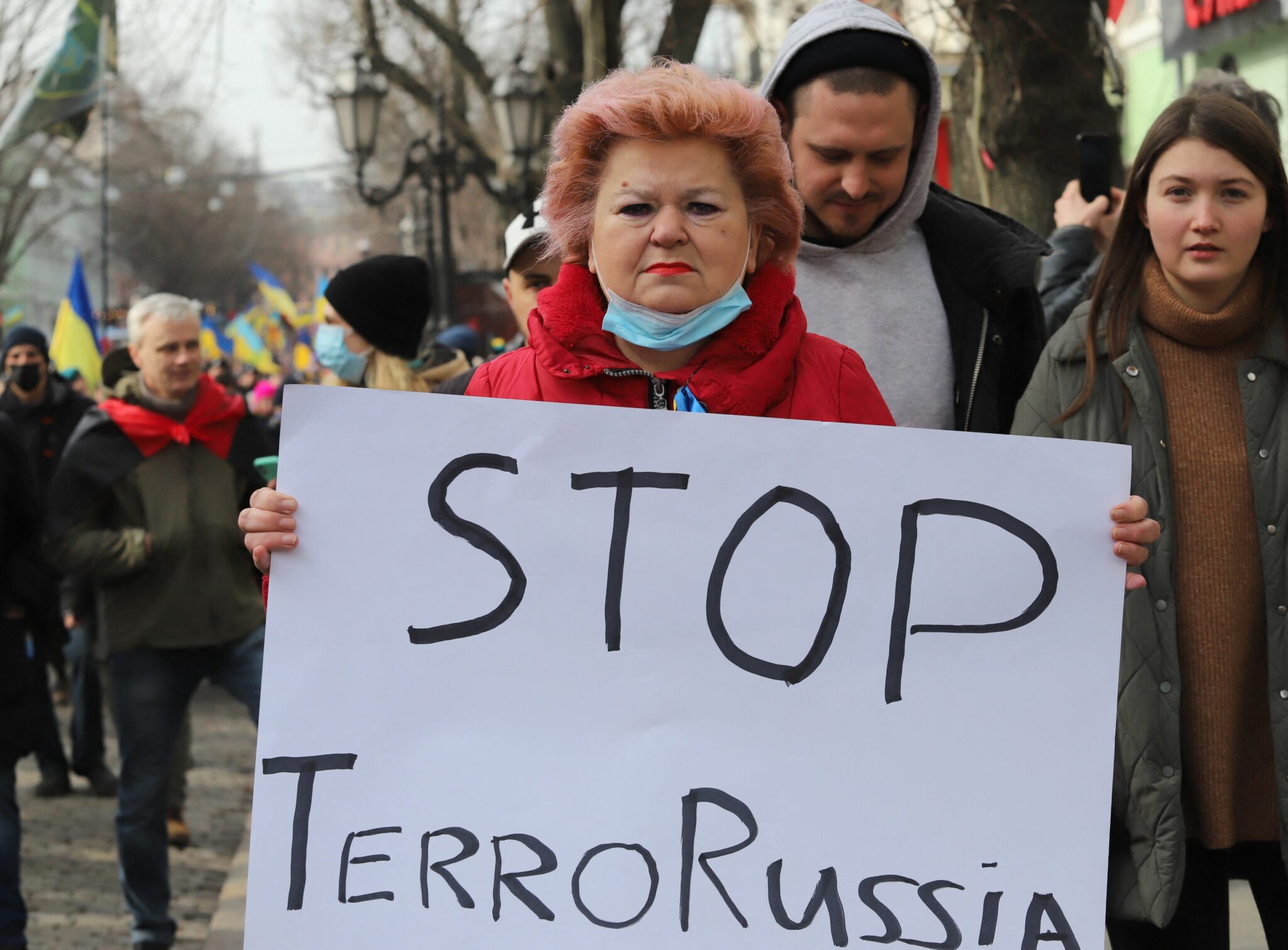 A protester holds a placard during a rally to show unity and support of Ukrainian integrity, amid soaring tensions with Russia, in the southern Ukrainian city of Odessa, on February 20, 2022. Ukraine and Russia both on February 20 called for intensified diplomatic efforts to avert all-out war, but blamed each other for a sharp escalation in shelling on Kyiv's frontline with Moscow-backed separatists. (Photo by Oleksandr GIMANOV / AFP)