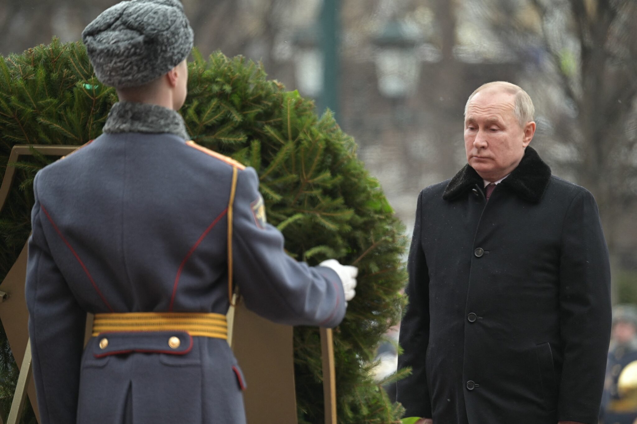 Russian President Vladimir Putin attends a wreath laying ceremony at the Tomb of the Unknown Soldier by the Kremlin wall to mark the Defender of the Fatherland Day in Moscow on February 23, 2022. (Photo by Alexey NIKOLSKY / SPUTNIK / AFP)