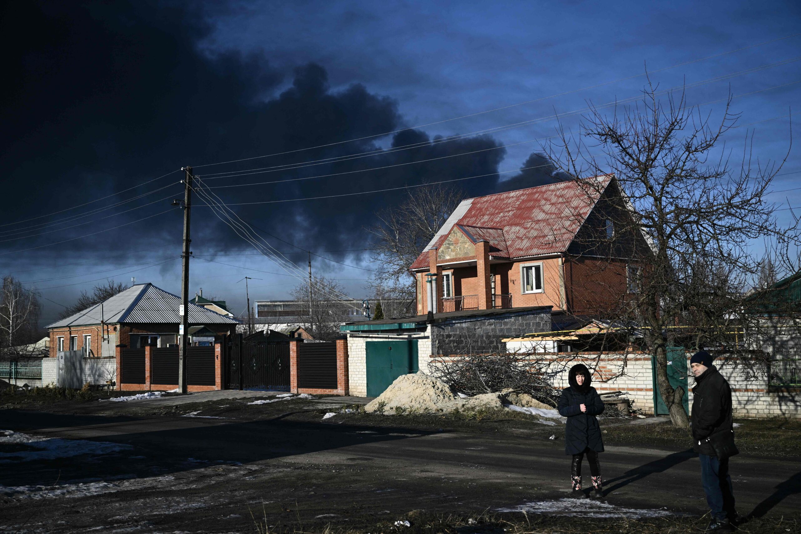 TOPSHOT - Black smoke rises from a military airport in Chuguyev near Kharkiv on February 24, 2022. Russian President Vladimir Putin announced a military operation in Ukraine on Thursday with explosions heard soon after across the country and its foreign minister warning a "full-scale invasion" was underway. (Photo by Aris Messinis / AFP)