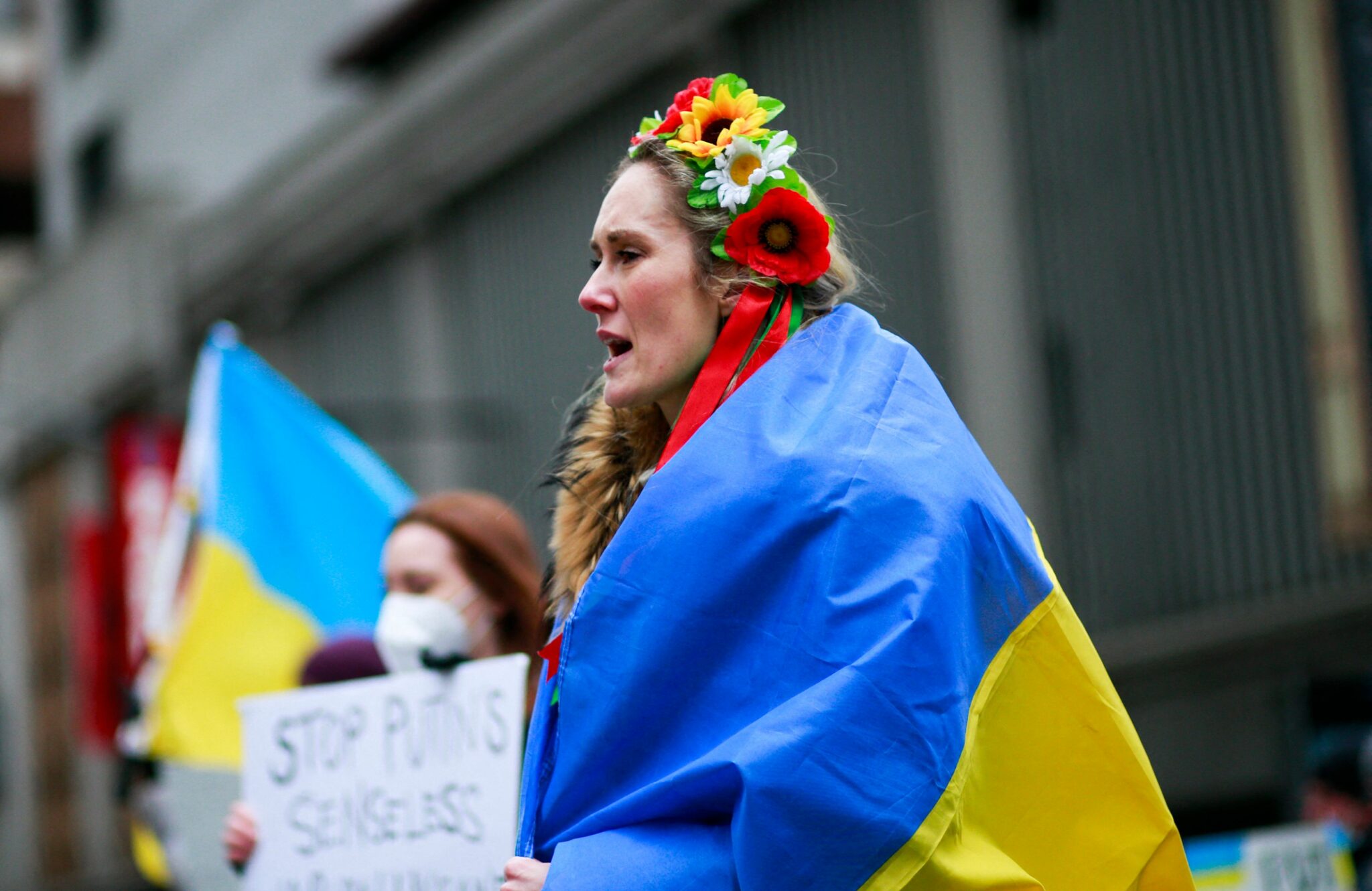 Demonstrators protest in support of Ukraine, in Times Square New York, on February 24, 2022. Russian President Vladimir Putin launched a full-scale invasion of Ukraine on Thursday, unleashing air strikes and ordering ground troops across the border in fighting that Ukrainian authorities said left dozens of people dead. (Photo by KENA BETANCUR / AFP)