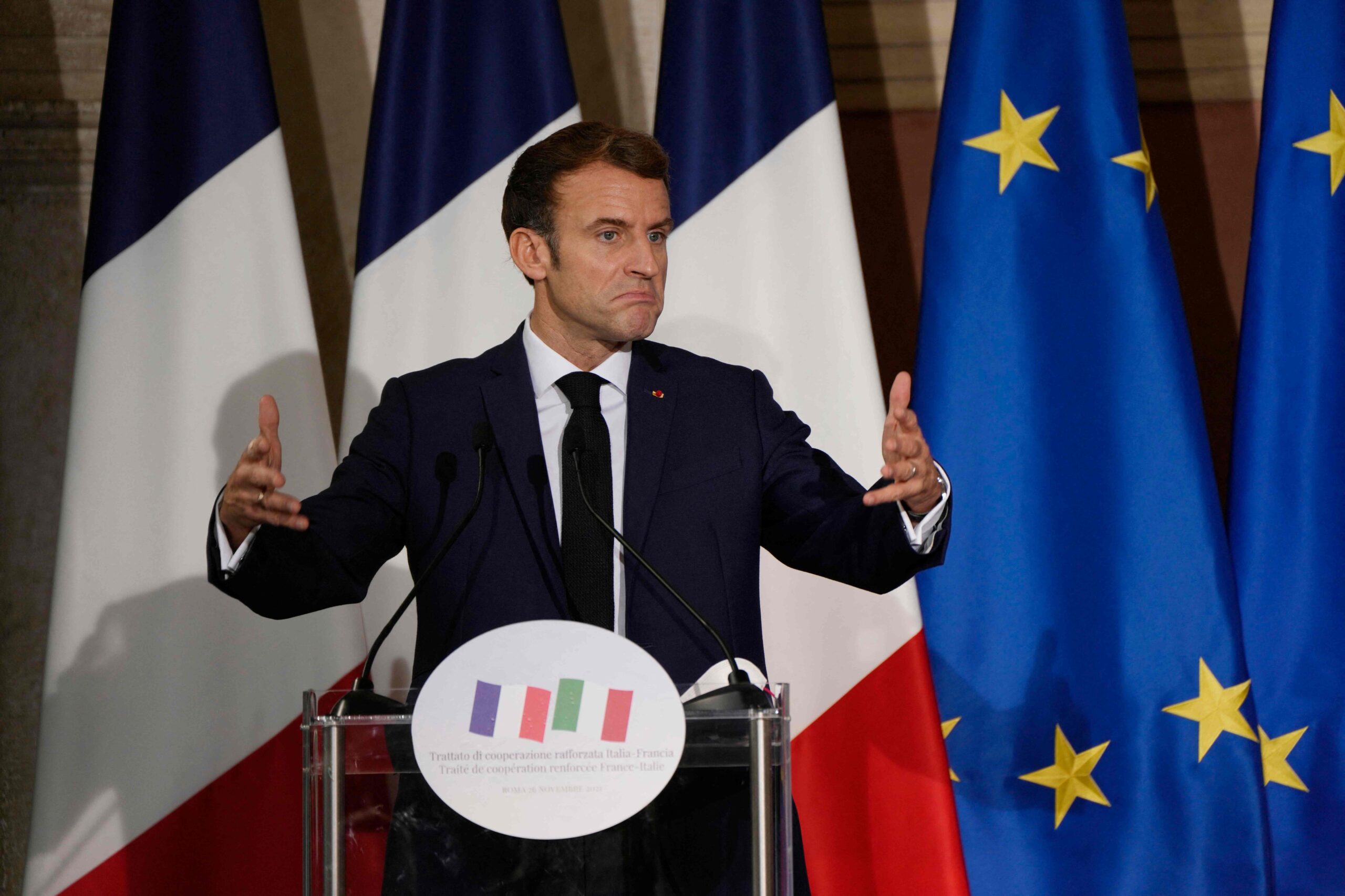 French President Emmanuel Macron and Italian Prime Minister (not seen) hold a joint press conference after signing the Quirinal Treaty between Italy and France, which aims to provide a stable and formalized framework for cooperation in relations between the two countries, at Villa Madama in Rome, on November 26, 2021. (Photo by Domenico Stinellis / POOL / AFP)