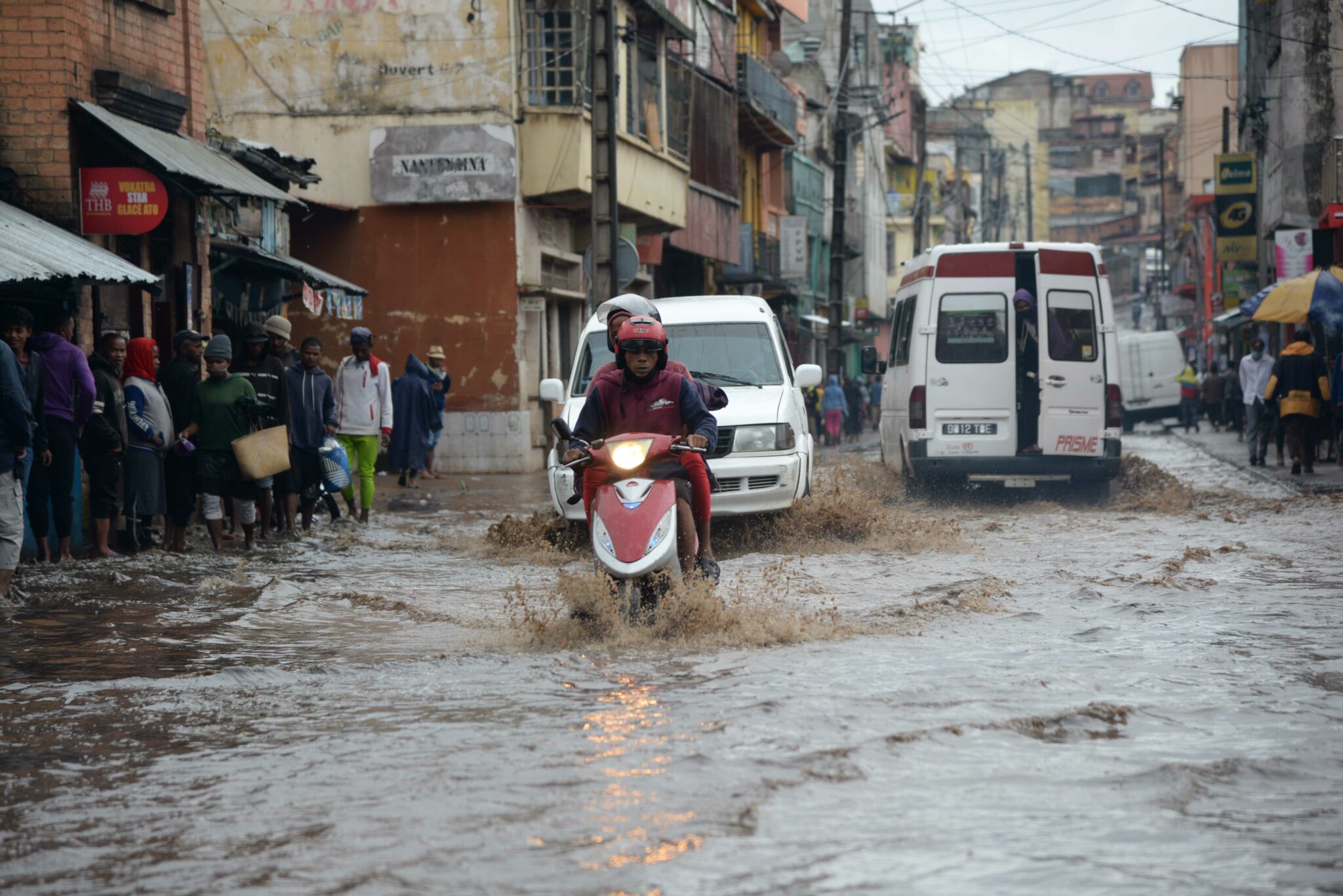 (220207) -- ANTANANARIVO, Feb. 7, 2022 (Xinhua) -- A man rides a motorcycle through a flooded road in Antananarivo, Madagascar, on Feb. 6, 2022. A total of 20 deaths were recorded Monday in Madagascar by the Office of Risk and Disaster Management, following the passage of intense tropical cyclone Batsirai Saturday and Sunday. (Photo by Sitraka Rajaonarison/Xinhua)