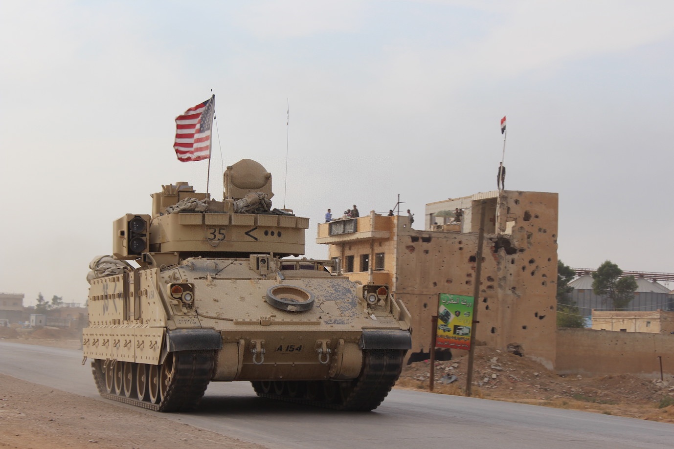 (211208) -- BEIJING, Dec. 8, 2021 (Xinhua) -- A U.S. military vehicle runs past the Tal Tamr area in the countryside of Hasakah province, northeastern Syria, on Nov. 14, 2019. (Str/Xinhua)