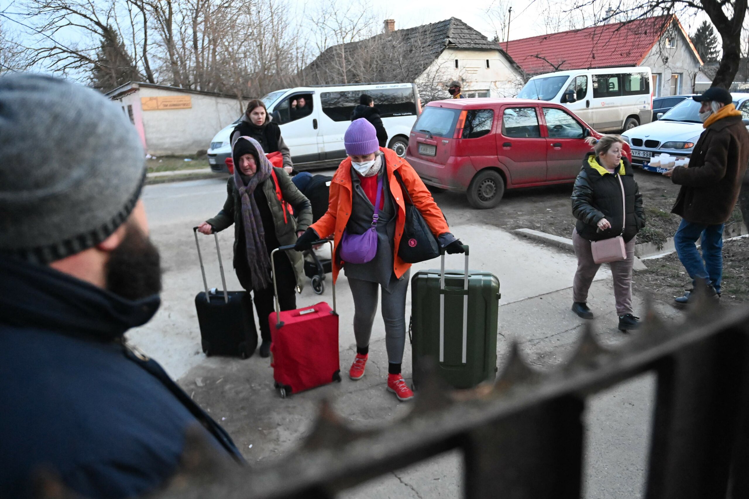 Ukrainian refugees arrive by bus from the Hungarian-Ukrainian border at Tiszabecs village, to their temporary camp in the local primary school on February 28, 2022. More than half a million people have fled Ukraine since Russia launched its full-scale invasion five days ago, with more than half fleeing into Poland, the United Nations said on February 28, 2022. (Photo by Attila KISBENEDEK / AFP)