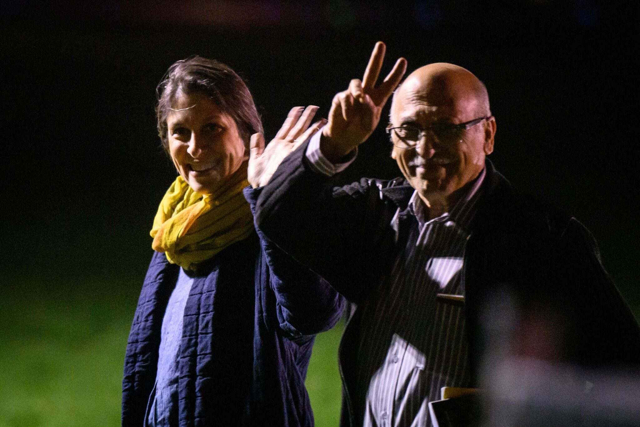 Nazanin Zaghari-Ratcliffe (L) and Anoosheh Ashoori, who were freed from Iran, gesture after landing at RAF Brize Norton on March 17, 2022 in Brize Norton, England. Nazanin Zaghari-Ratcliffe and Anoosheh Ashoori, two British-Iranians who spent years detained in Iran, arrived back in the UK early on March 17 after London settled a longstanding debt over a cancelled defence contract with Tehran. Nazanin Zaghari-Ratcliffe and Anoosheh Ashoori touched down at RAF Brize Norton in southwest England at 01:08am (0108 GMT) after being released on March 16. (Photo by Leon Neal / POOL / AFP)