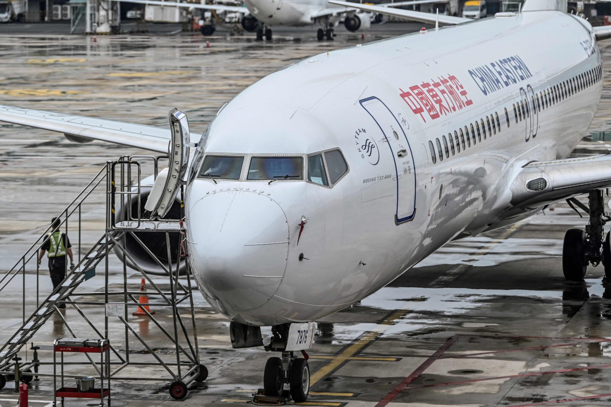 (FILES) This file photo taken on May 29, 2020 shows a China Eastern Airlines Boeing 737-800 aircraft parked at the Tianhe Airport in Wuhan, Chinas central Hubei province. A China Eastern passenger jet carrying at least 132 people has "crashed" in southwest China, the state flight regulator confirmed on March 21, 2022, with the number of casualties unknown according to the country's state broadcaster. (Photo by Hector RETAMAL / AFP)