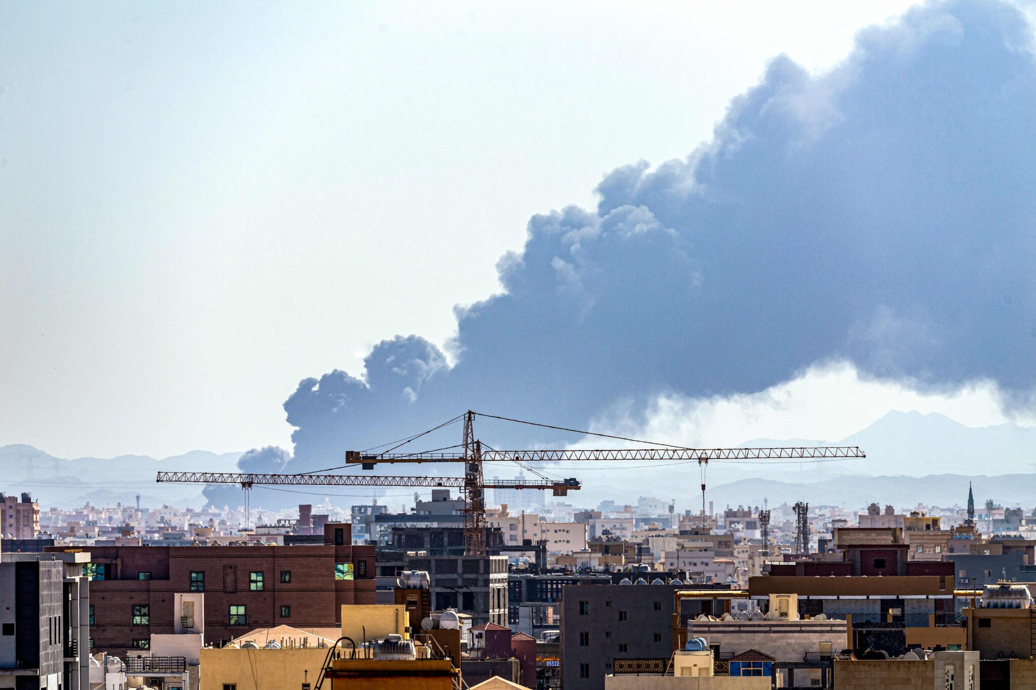 Smoke rises from a Saudi Aramco oil facility in Saudi Arabia's Red Sea coastal city of Jeddah, on March 26, 2022, following a reported Yemeni rebels attack. Yemeni rebels said they attacked a Saudi Aramco oil facility in Jeddah as part of a wave of drone and missile assaults today as a huge cloud of smoke was seen near the Formula One venue in the city. (Photo by Andrej ISAKOVIC / AFP)