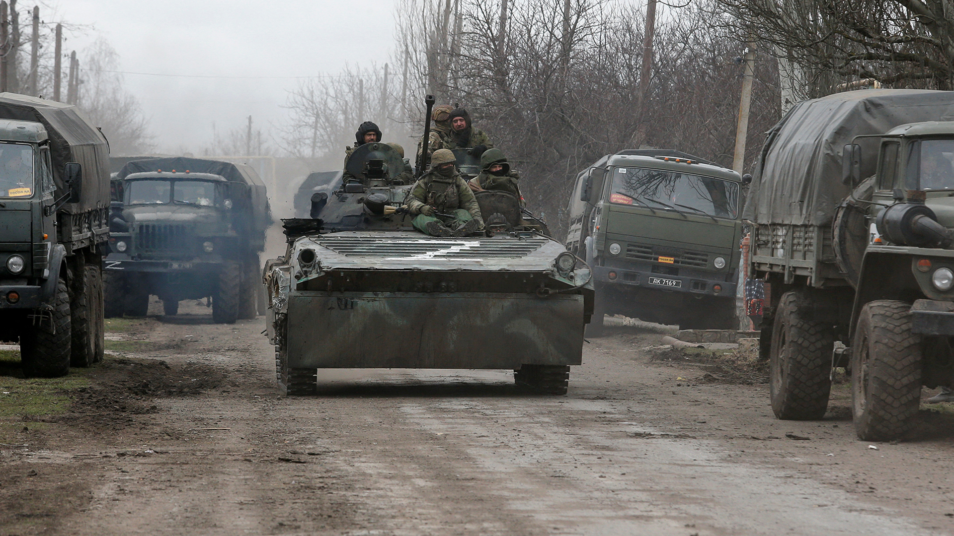 Service members of pro-Russian troops in uniforms without insignia are seen atop of an armoured vehicle with the letter "Z" painted on its front in the separatist-controlled settlement of Buhas (Bugas), as Russia's invasion of Ukraine continues, in the Donetsk region, Ukraine March 1, 2022. REUTERS/Alexander Ermochenko