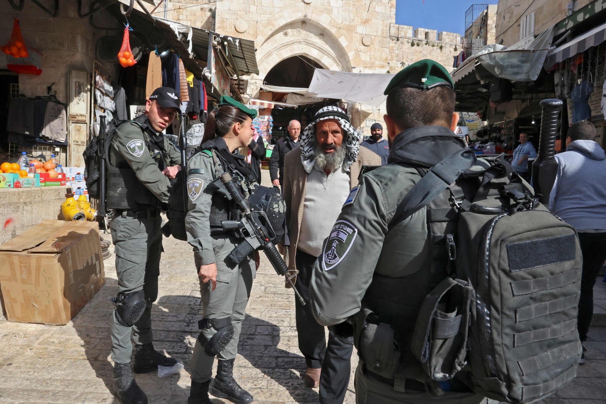 Israeli security forces check Palestinians heading to the al-Aqsa mosque compound for Friday prayers on April 1, 2022 in the Old City of Jerusalem. (Photo by HAZEM BADER / AFP)