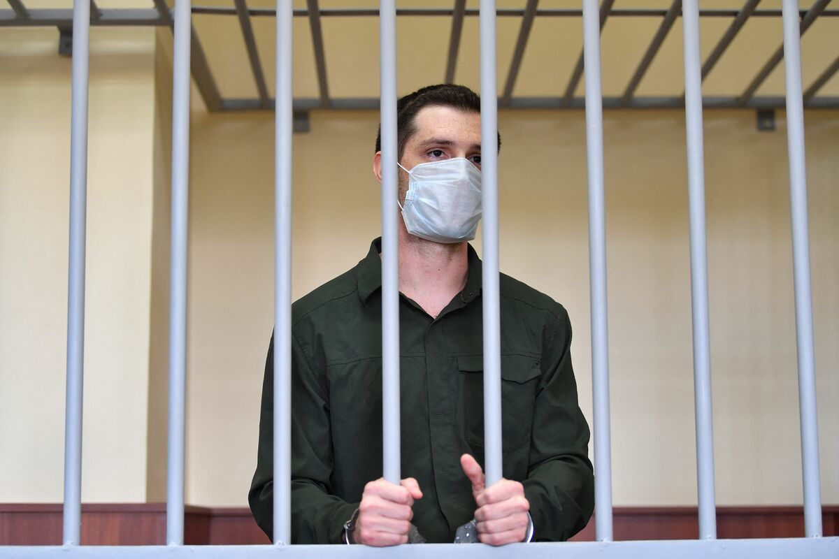 (FILES) In this file photo taken on July 30, 2020 US ex-marine Trevor Reed, charged with attacking police, stands inside a defendants' cage during his verdict hearing at Moscow's Golovinsky district court. Moscow said on April 27, 2022 it has exchanged former US marine Trevor Reed, jailed in Russia for assaulting police, for Russian pilot Konstantin Yaroshenko, who was convicted of drug smuggling in the United States. (Photo by Dimitar DILKOFF / AFP)