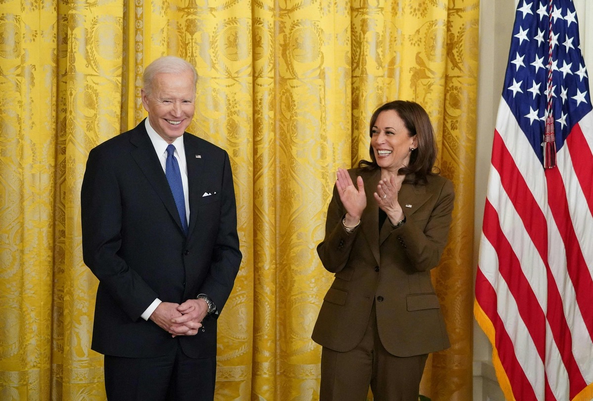 (FILES) In this file photo taken on April 05, 2022 US President Joe Biden (L) and US Vice President Kamala Harris attend an event on the Affordable Care Act and Medicaid in the East Room of the White House in Washington, DC. US Vice President Kamala Harris tested positive for Covid-19 on April 26, 2022 but is asymptomatic and not considered a current close contact of President Joe Biden, the White House said. (Photo by MANDEL NGAN / AFP)