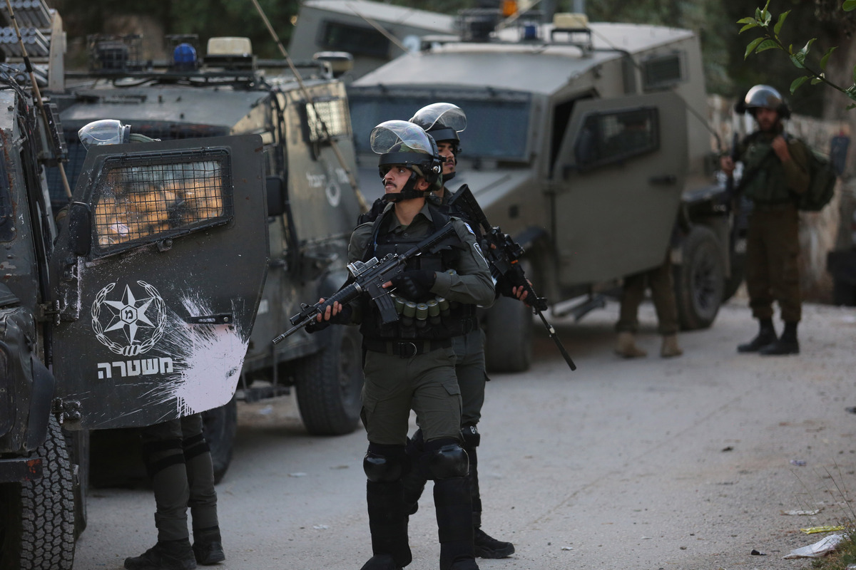 (220508) -- JENIN, May 8, 2022 (Xinhua) -- Israeli security forces launch a raid on the houses of the two Palestinian suspects in the village of Romana near the West Bank city of Jenin, on May 8, 2022. Earlier on Sunday, Israeli security forces said after a three-day manhunt, the two suspects were captured in a forest near Elad, an ultra-Orthodox Jewish city where they killed three men and injured four others on Israel's Independence Day on Thursday. (Photo by Nidal Eshtayeh/Xinhua)