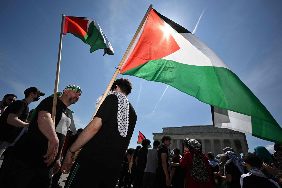 Activists take part in a rally to mark Nakba, the catastrophe, at the Lincoln Memorial in Washington, DC on May 15, 2022. Seventy-four years after Israels creation, the day is commemorated by Palestinians as the catastrophe. More than 700,000 Palestinians fled or were forced from their homes during the conflict that surrounded Israel's creation. (Photo by MANDEL NGAN / AFP)