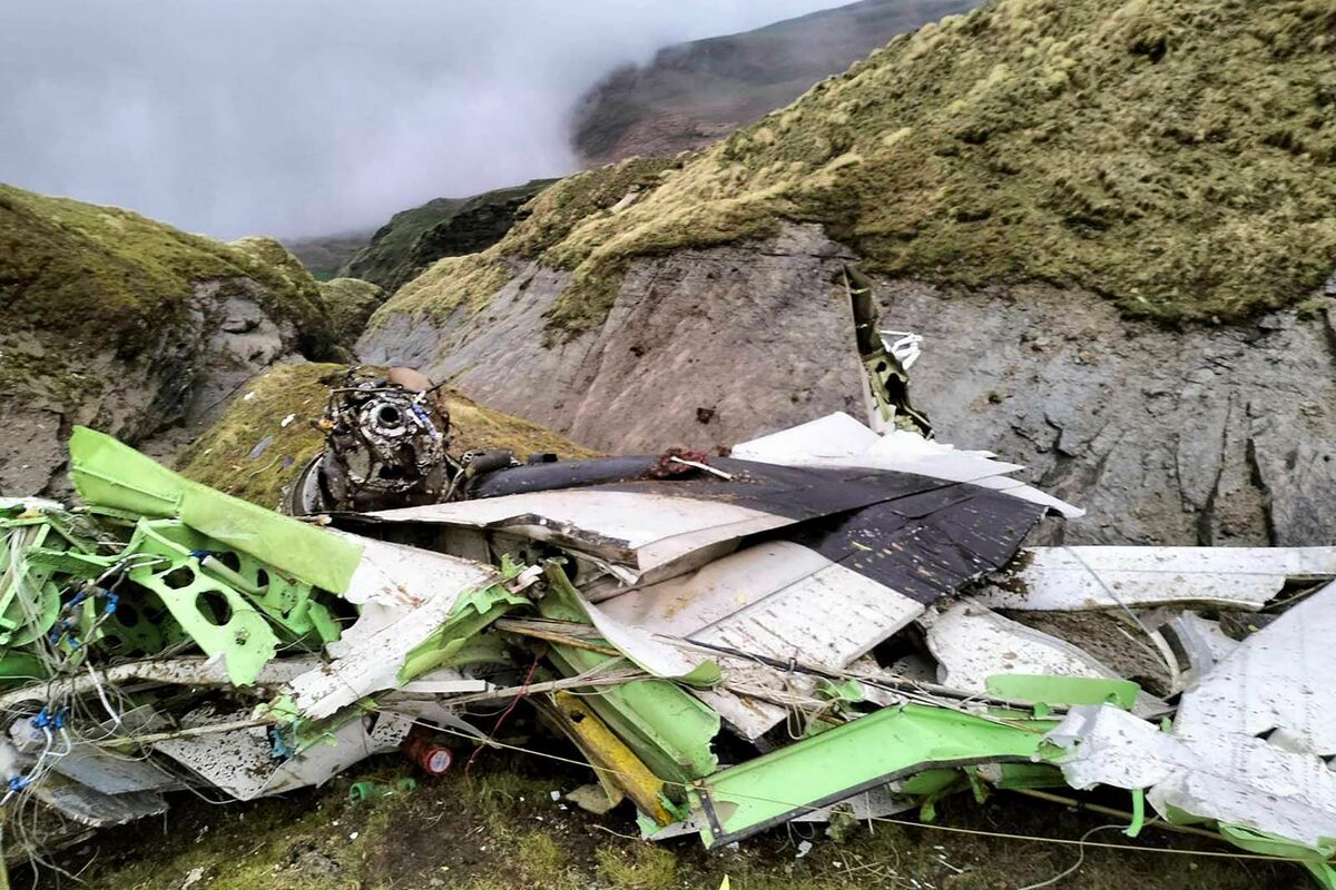 This handout photograph taken on May 30, 2022 and released by the Nepal Police shows the wreckage of a Twin Otter aircraft, operated by Nepali carrier Tara Air, laying on a mountainside in Mustang, a day after it crashed. Nepali rescuers on May 30 retrieved 16 bodies from the mangled wreckage of a passenger plane strewn across a mountainside that crashed in the Himalayas with 22 people on board. - -----EDITORS NOTE --- RESTRICTED TO EDITORIAL USE - MANDATORY CREDIT "AFP PHOTO/Nepal Police" - NO MARKETING - NO ADVERTISING CAMPAIGNS - DISTRIBUTED AS A SERVICE TO CLIENTS - NO ARCHIVES (Photo by Man Bahadur Basyal / NEPAL POLICE / AFP) / -----EDITORS NOTE --- RESTRICTED TO EDITORIAL USE - MANDATORY CREDIT "AFP PHOTO/Nepal Police" - NO MARKETING - NO ADVERTISING CAMPAIGNS - DISTRIBUTED AS A SERVICE TO CLIENTS - NO ARCHIVES