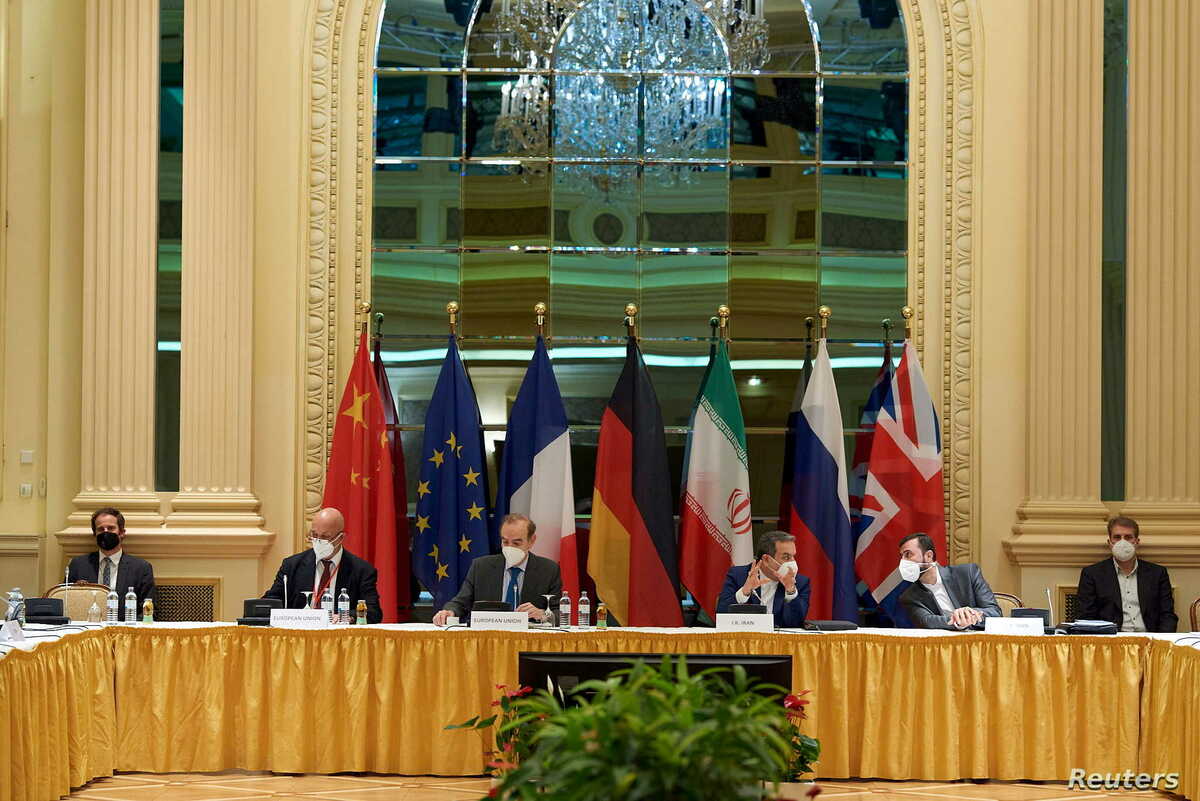 European External Action Service (EEAS) Deputy Secretary General Enrique Mora, Iranian Deputy at Ministry of Foreign Affairs Abbas Araghchi and Iran's ambassador to the U.N. nuclear watchdog Kazem Gharibabadi wait for the start of a meeting of the JCPOA Joint Commission in Vienna, Austria May 1, 2021. EU Delegation in Vienna/Handout via REUTERS ATTENTION EDITORS - THIS PICTURE WAS PROVIDED BY A THIRD PARTY.