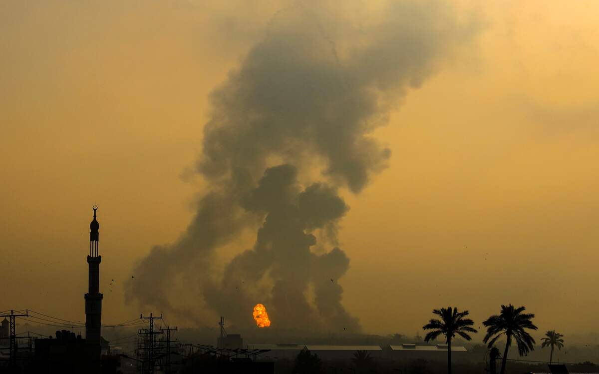 Fire erupts following an Israeli airstrike south of Gaza City on June 18, 2022. Israeli air strikes hit Hamas military sites in the Gaza Strip in response to rocket fire from the Palestinian enclave run by the Islamist movement, the Israeli army said. (Photo by Eyad BABA / AFP)