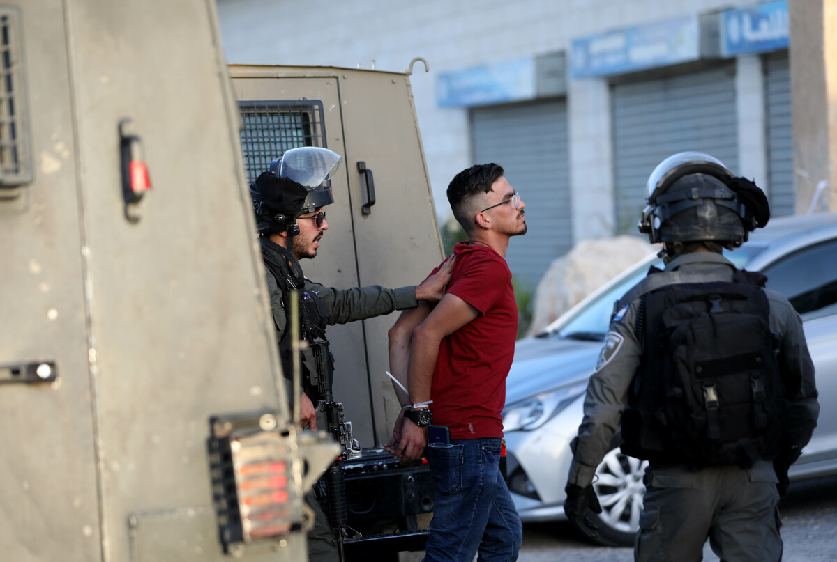 (220531) -- QALQILYA, May 31, 2022 (Xinhua) -- A Palestinian man is detained following a protest against the expansion of Jewish settlements in the village of Izbat at-Tabib near the West Bank city of Qalqilya, on May 31, 2022. (Photo by Ayman Nobani/Xinhua)